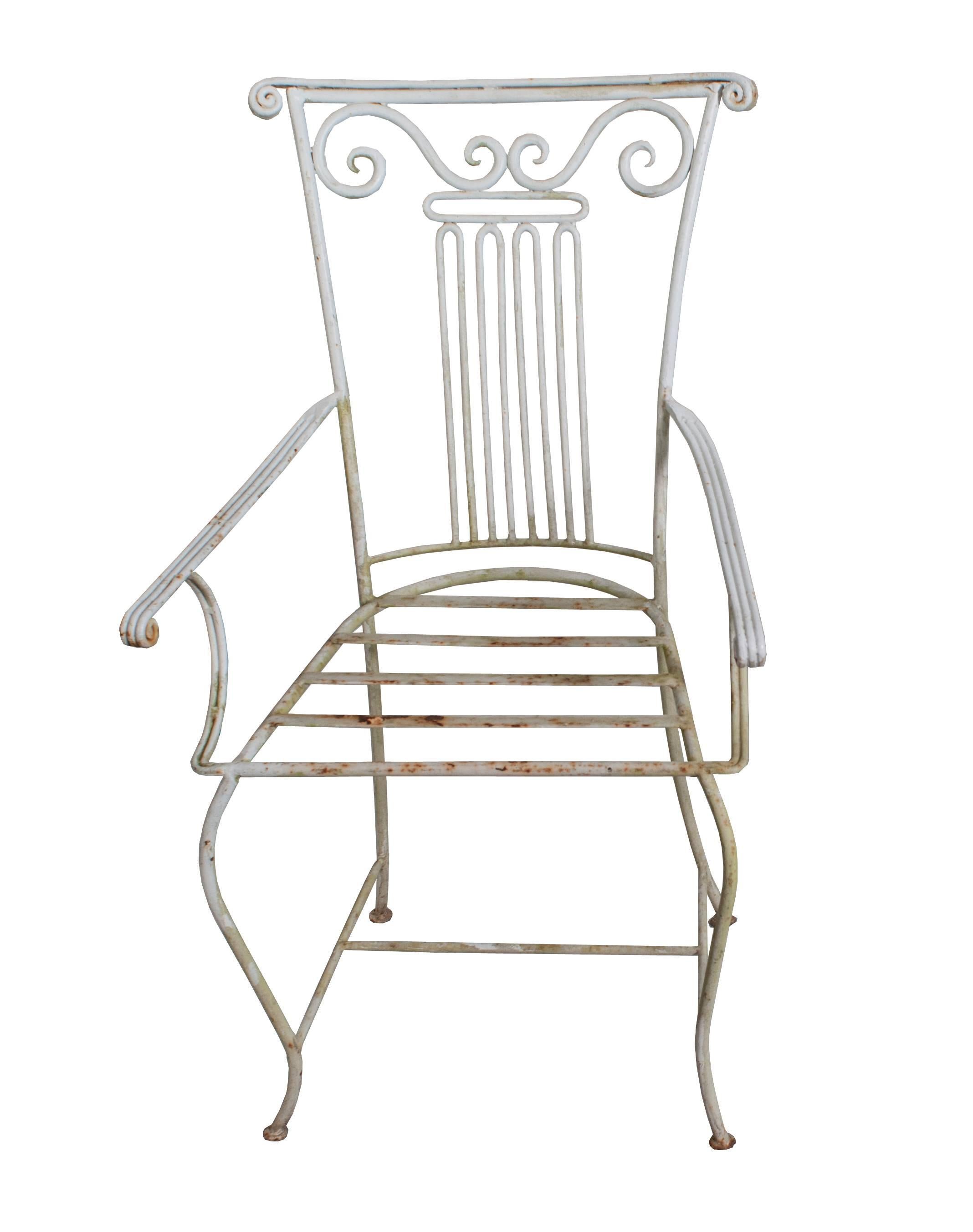 Set of three Neoclassical Wrought Iron Garden Chairs available for purchase individually.  Arm Height 25 inches.