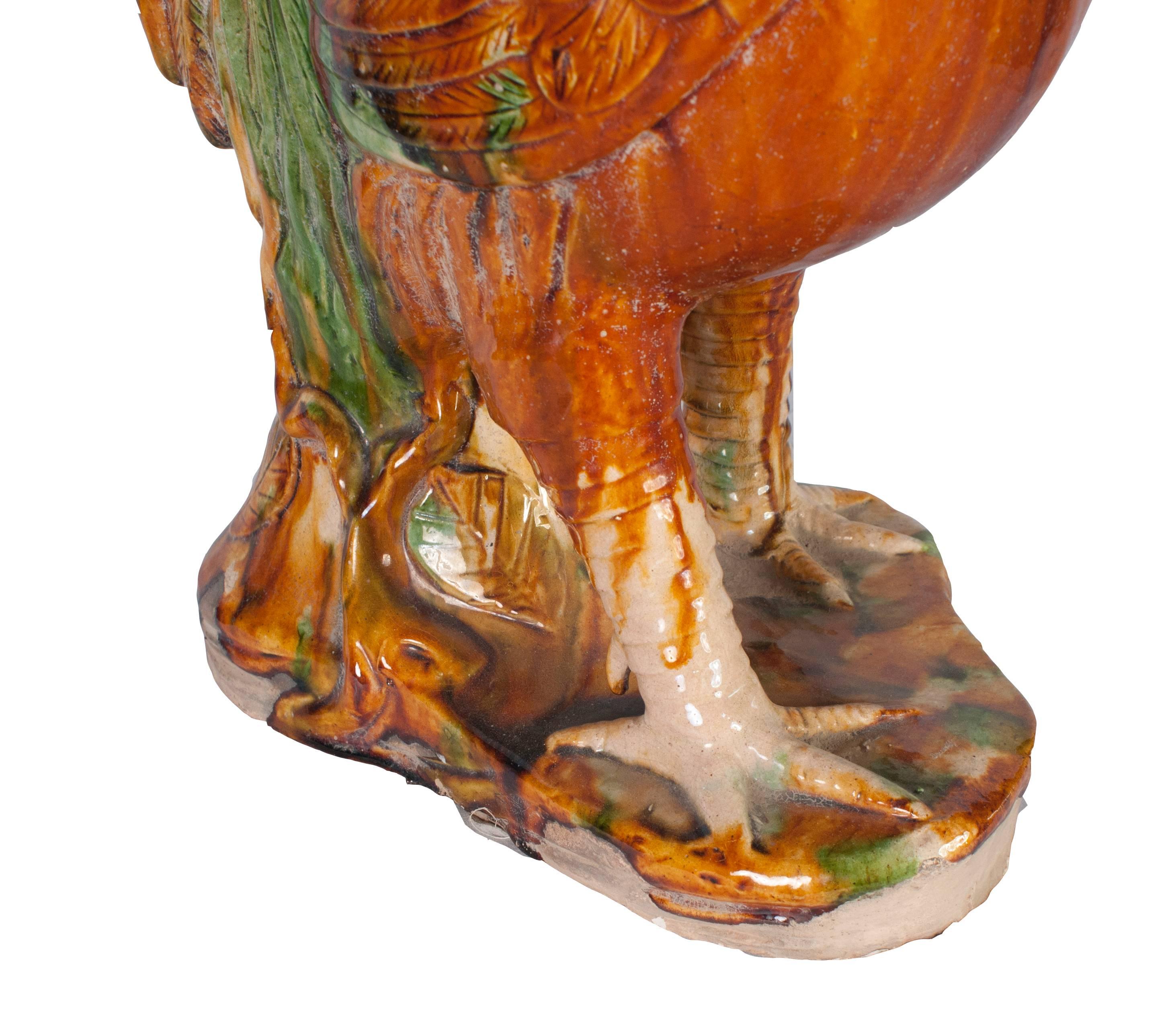 A painted terra cotta rooster.