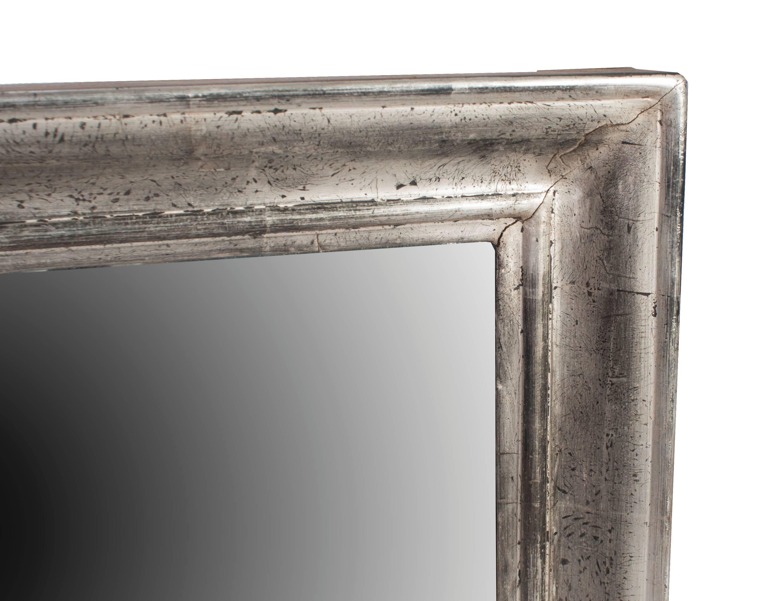A rectangular silver gilt mirror in its original mercury glass.