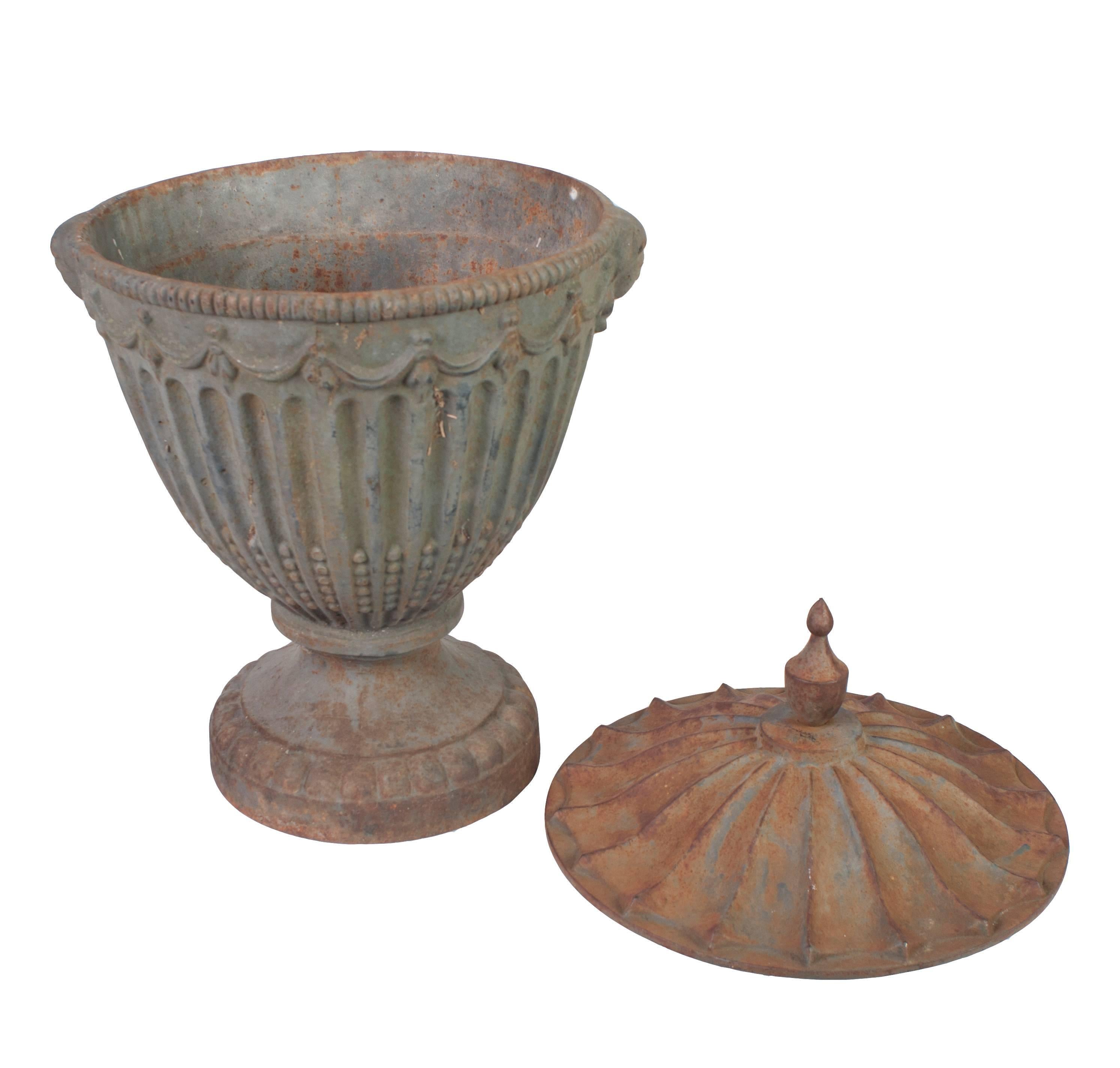 A pair of painted covered urns.
Base dimension is: 9.
  