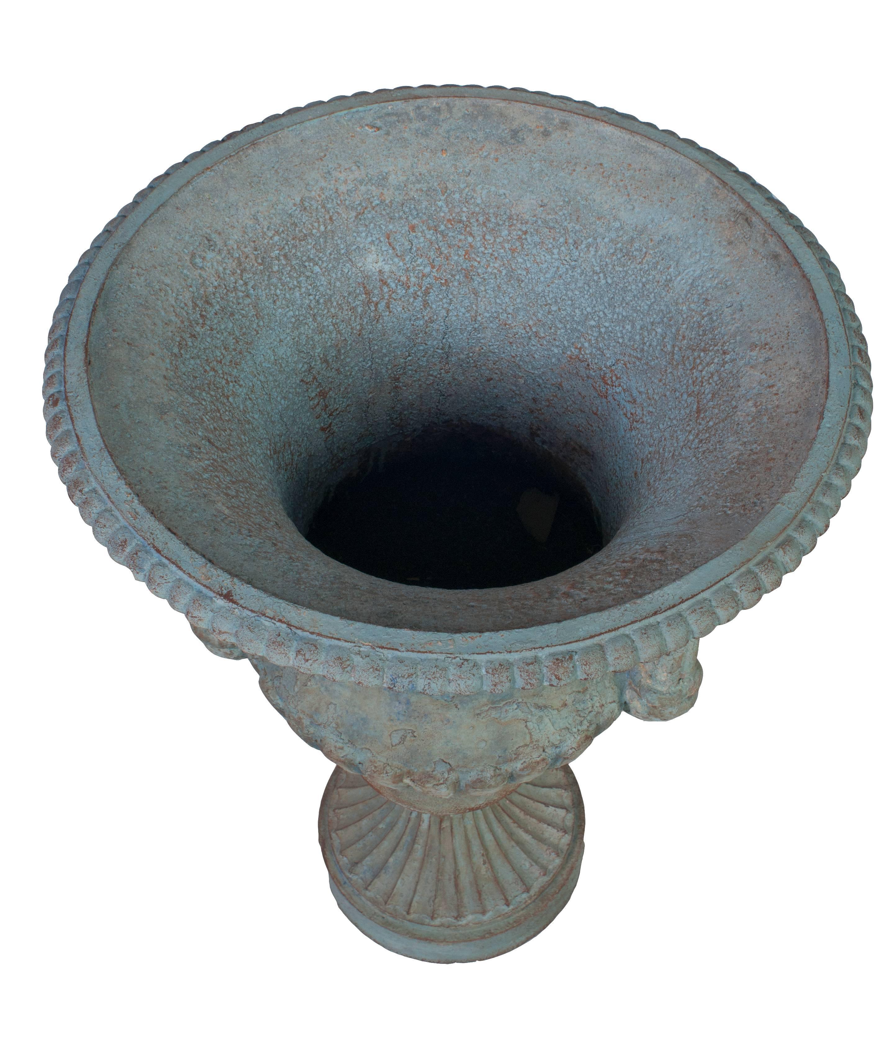 A large blue painted medici urn.
