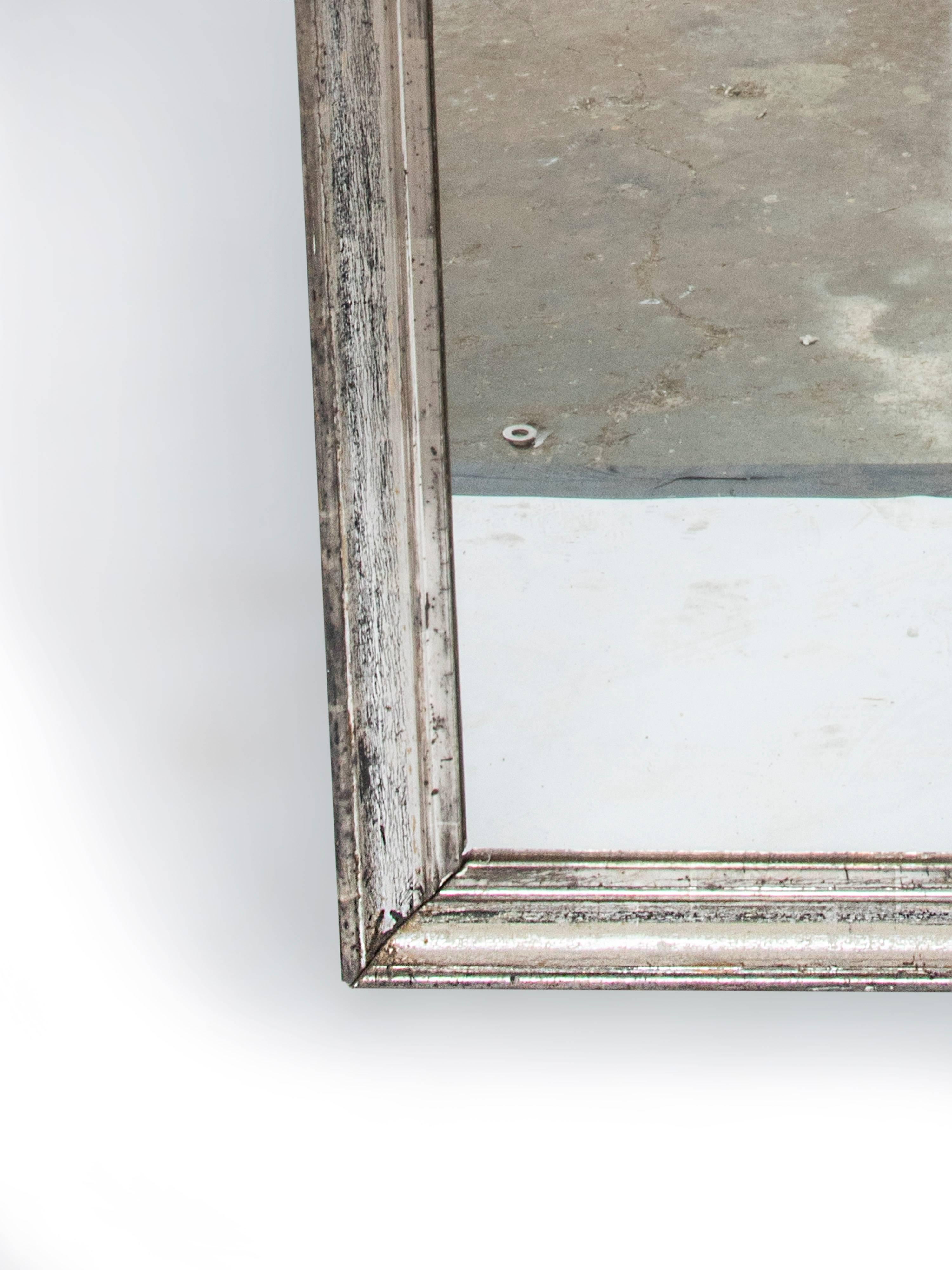 Rectangular silver gilt mirror with original mercury glass.