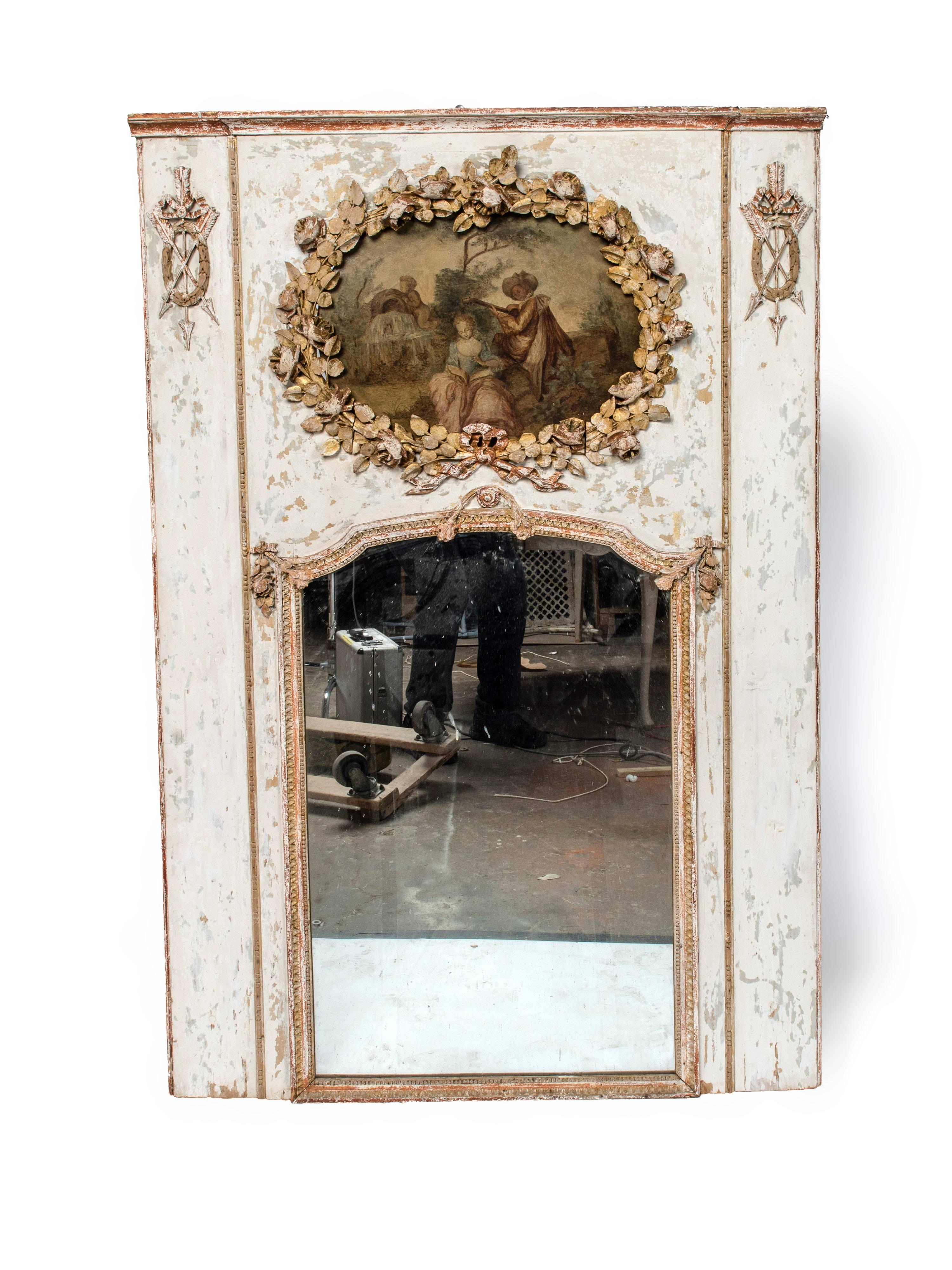 Very decorative gilt and hand-painted Louis XVI trumeau mirror with a hand-painted family scene with father playing a musical instrument, the gilding and paintwork has some wear.
