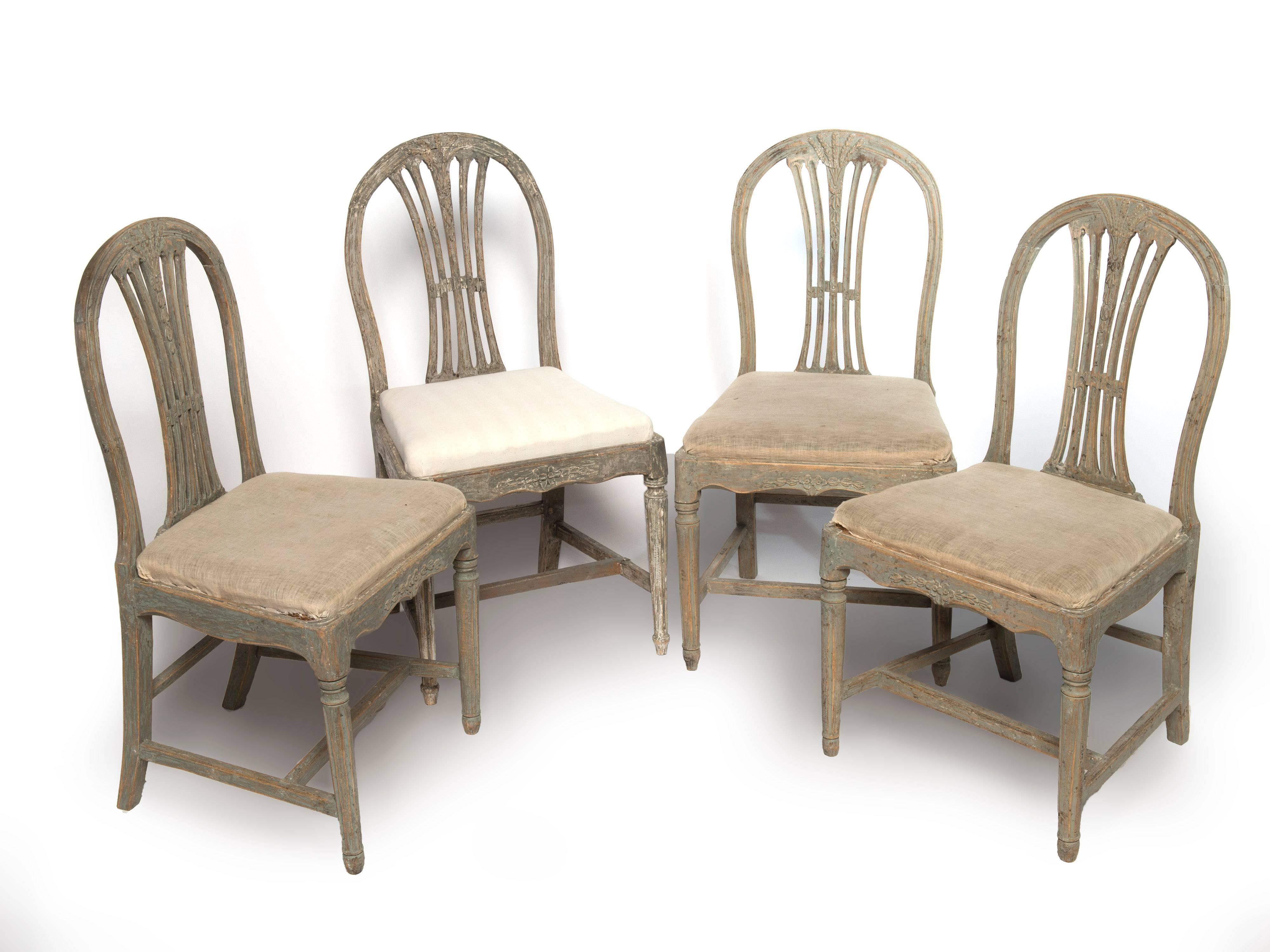 Matched set of four Gustavian dining chairs. We also have a set of six that can be combined with this set. The seats are covered in original muslin.