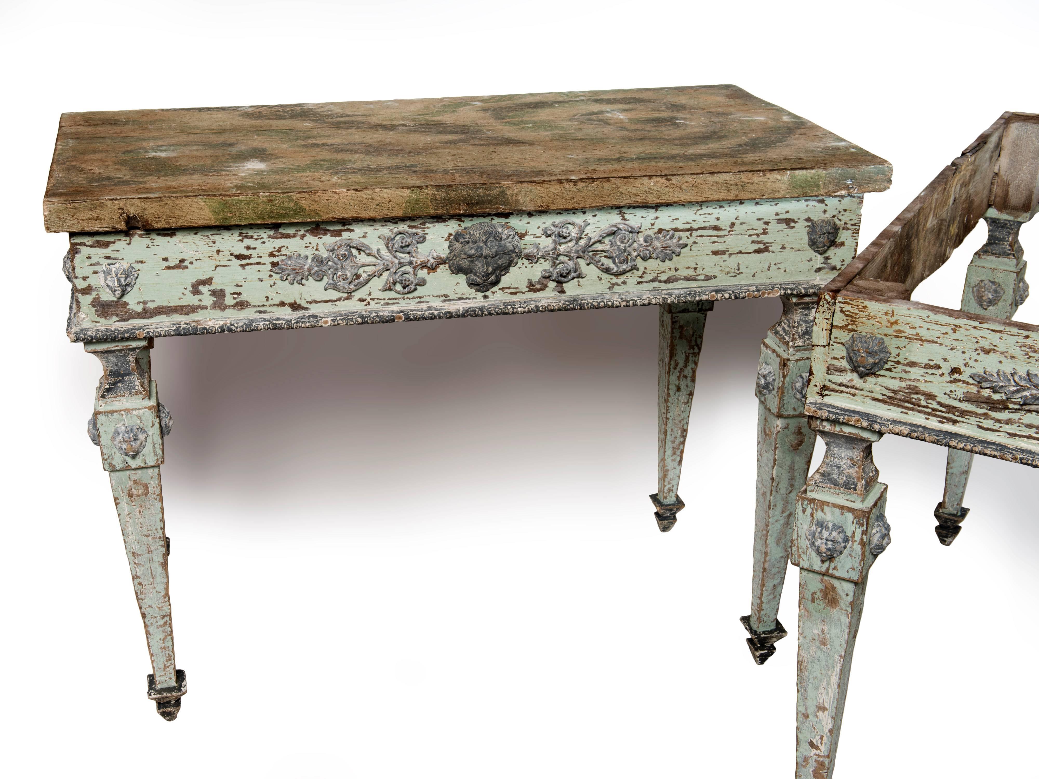 These are a very rare hand-painted pair of console tables sitting on square tapered legs with lion head motifs to the center and also the legs.
Neapolitan made in Italy.
The bottom of the consoles are hand-painted in a pale blue color which is the