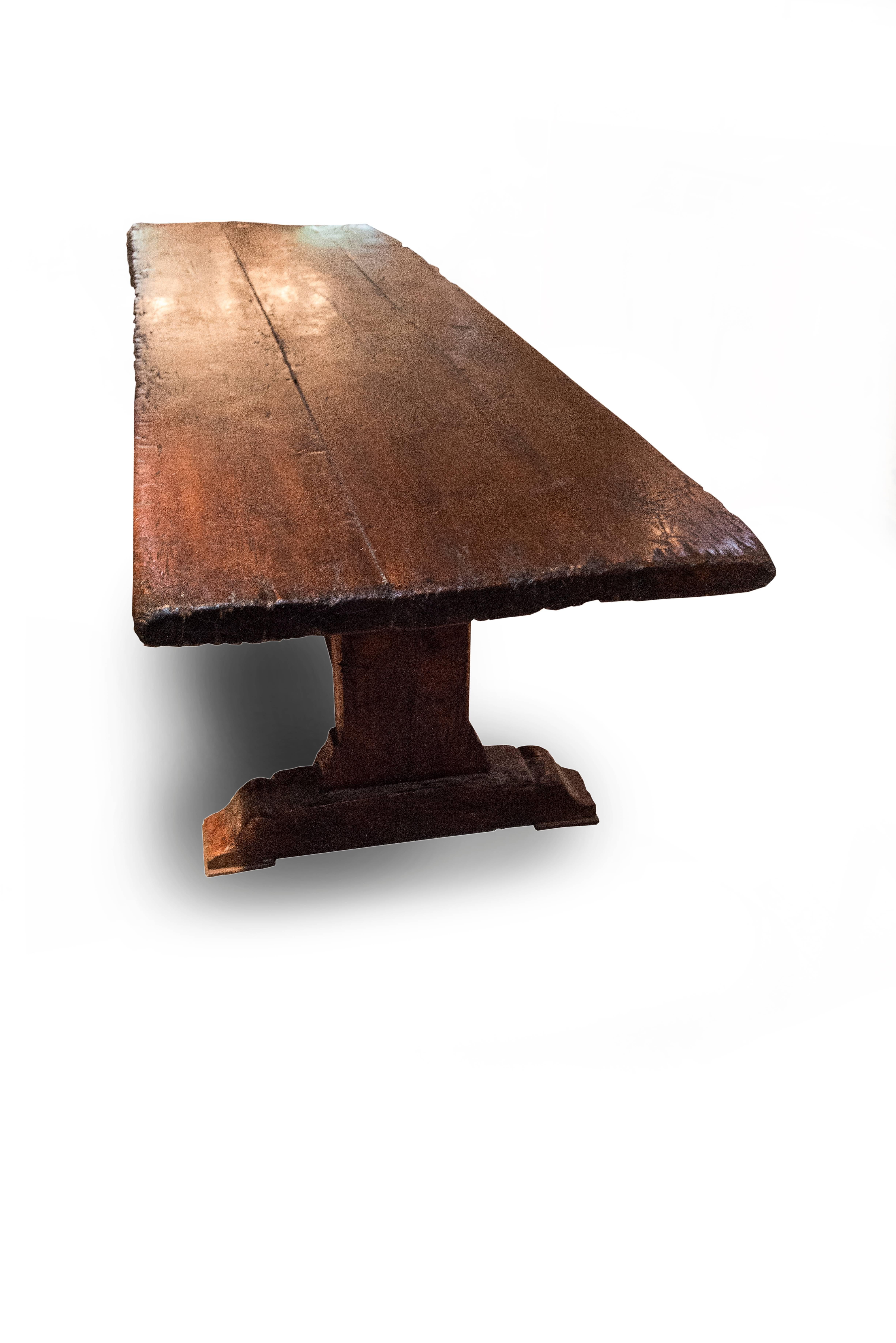 A rare and early 19th century rough oak monastery table that came out of a monastery in Haut Provence, France. The top is 2.25 inches thick. The table retains its beautiful rich, original color and patina from its years in the French monastery. It