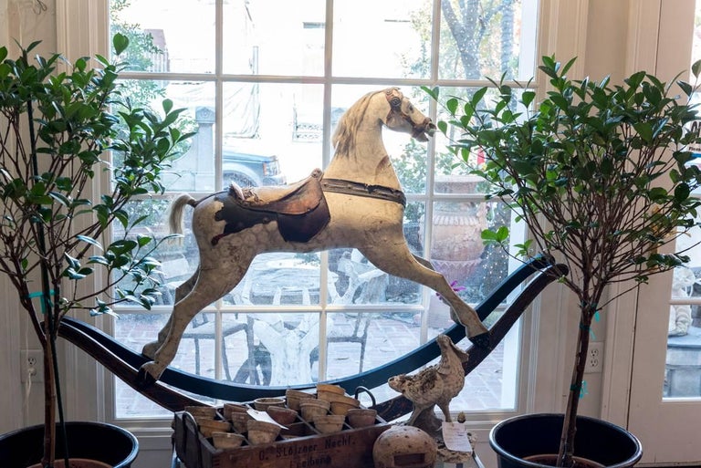 A painted rocking horse, with original mane, tail, saddle, bridel and original old paint.