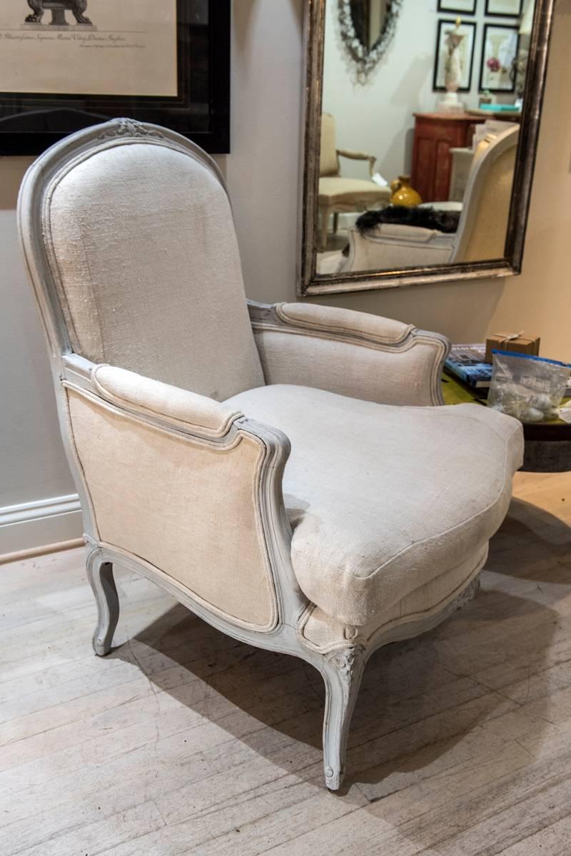 Pair of greyish white painted In the Style of Louis XV Bergere chairs.