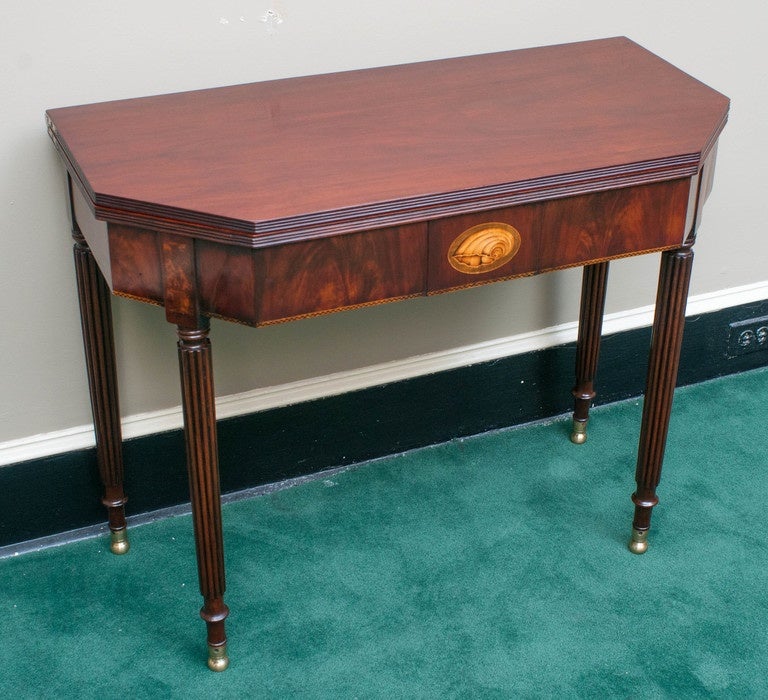 Probably New York, mahogany with satinwood and ebony inlay and poplar secondary wood, swivel top, brass hinges.