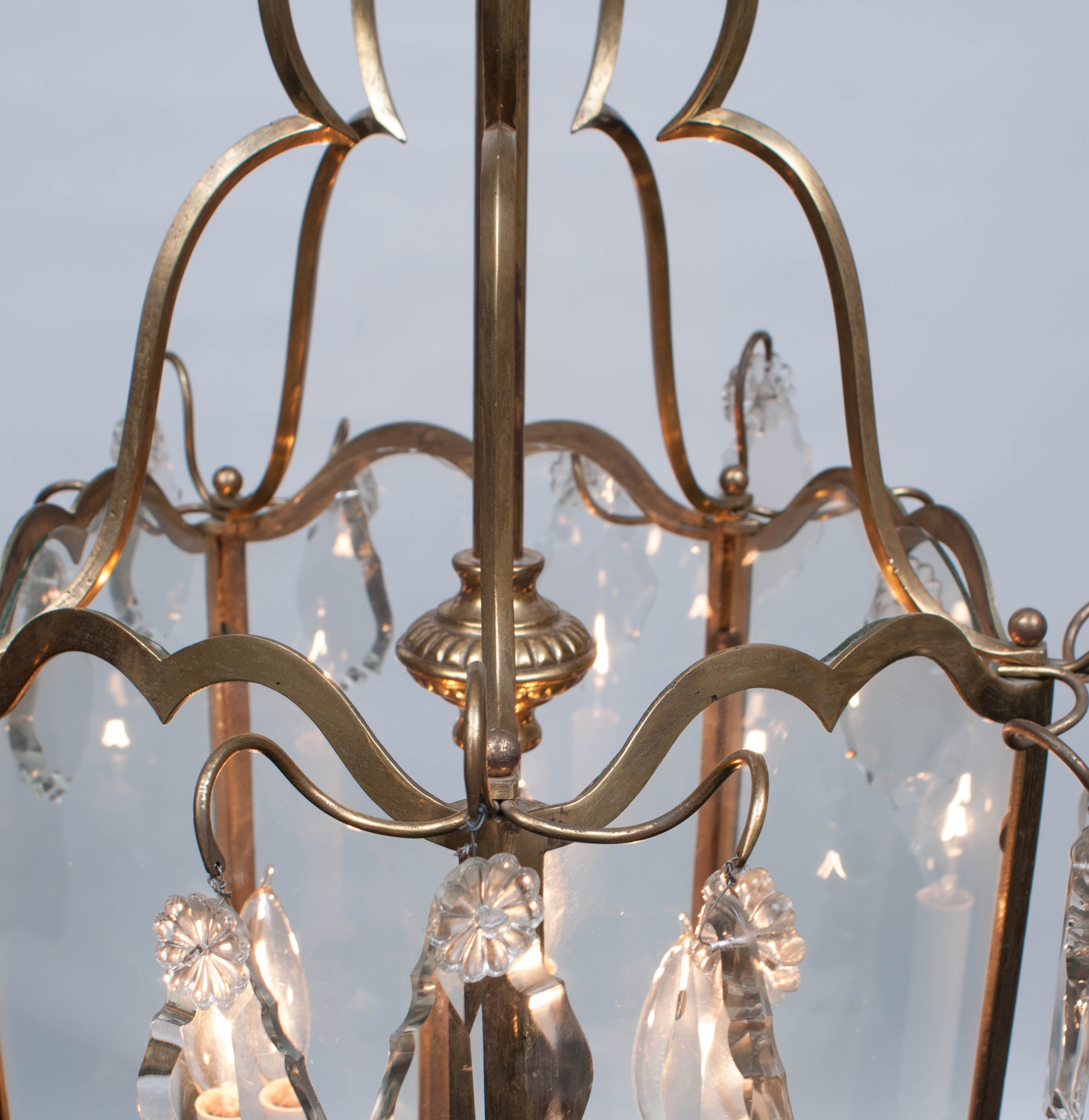 Three lights - 5-sided - lead crystal prisms - hanging hardware and appropriate ceiling cap and chain included.