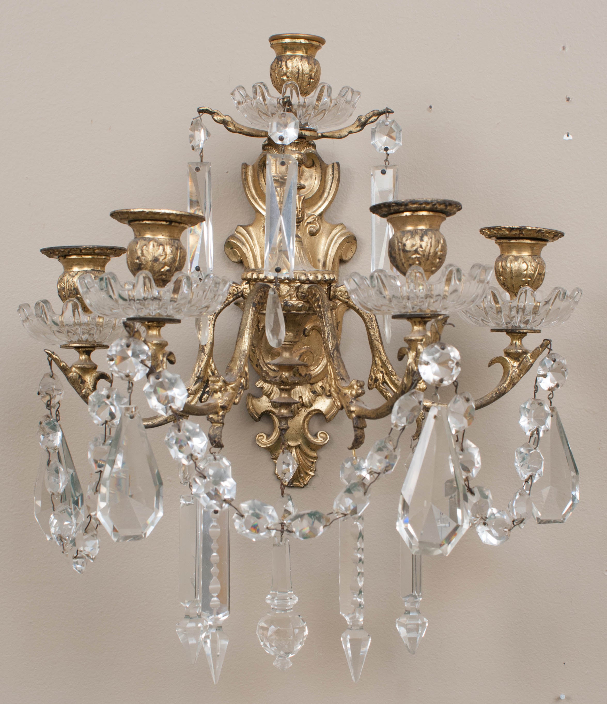 Five-light candle sconces - they have never been electrified but can be if desired - very fine casting and hand-cut crystal prisms.