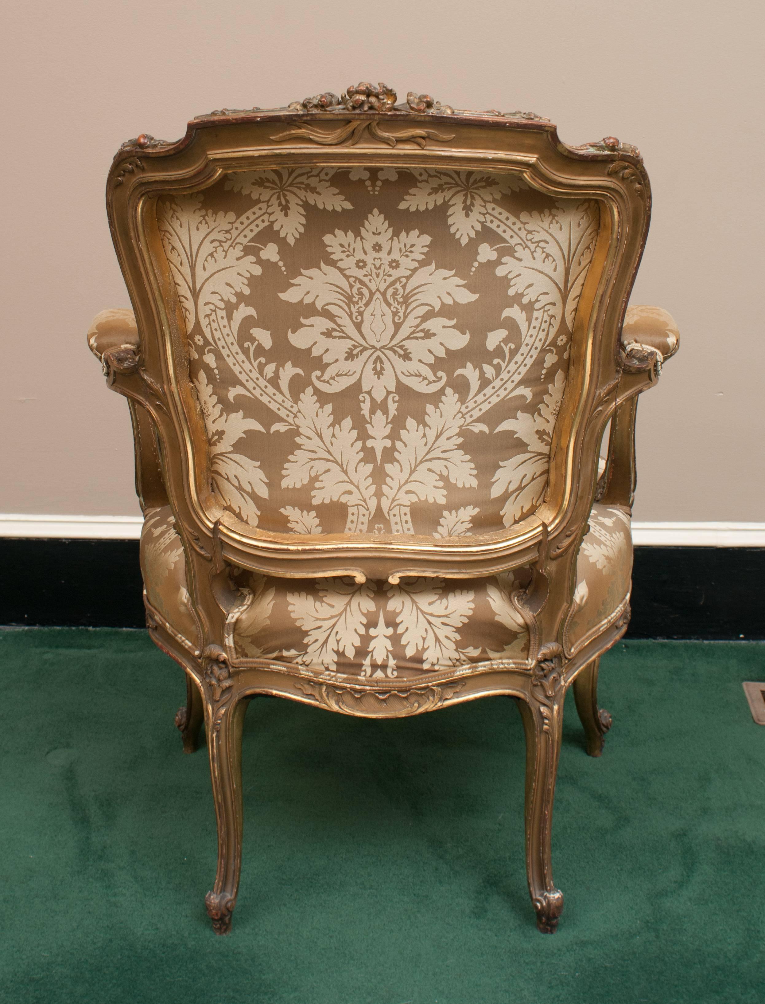 Probably Venice. Expertly carved fruitwood which was originally gilt, but through the years the gilt has worn and vertigrised to give the chair a gorgeous patina.