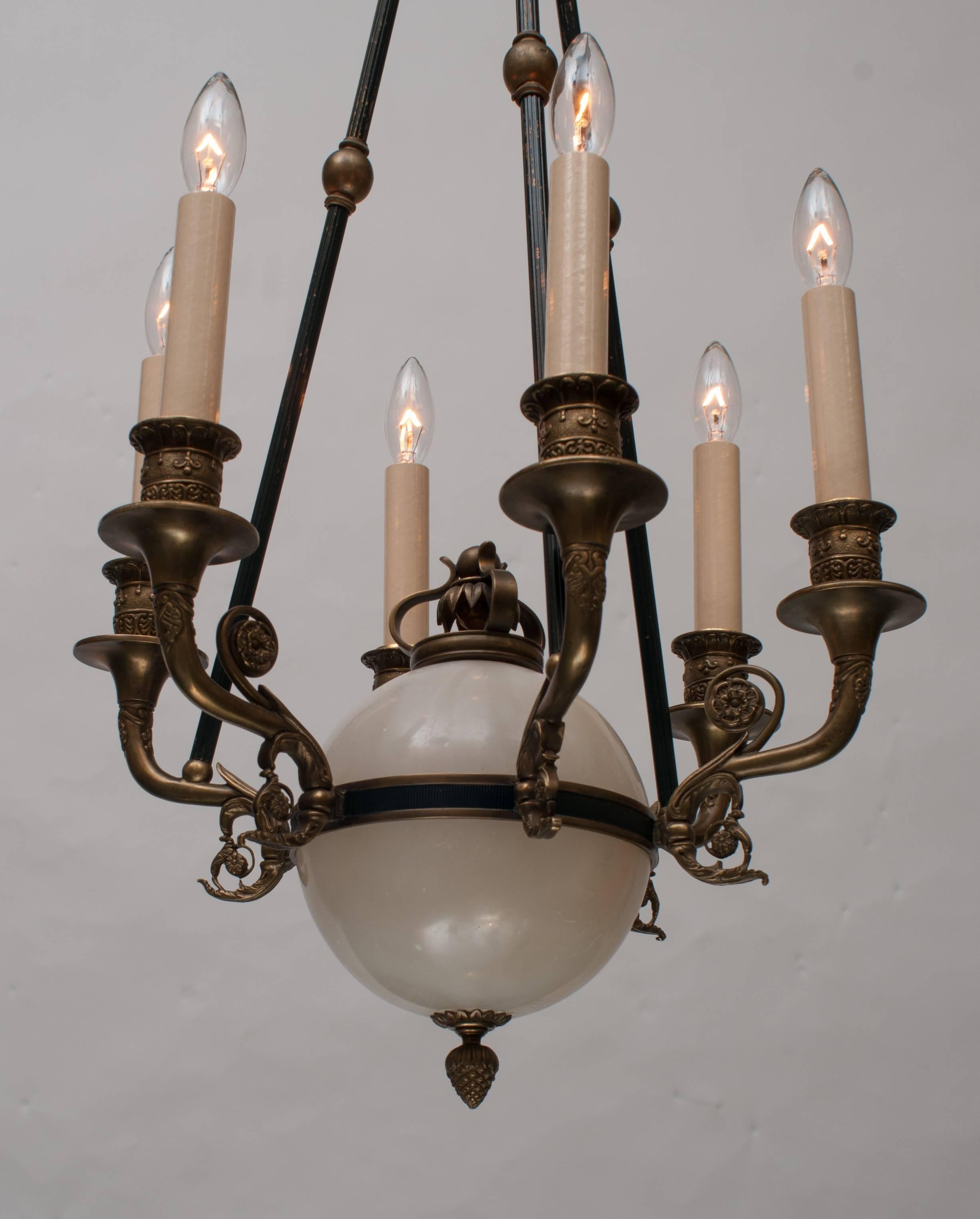 Unique alabaster orb, exceptionally fine hand-cast fittings and crown. Ceiling cap, chain, and hanging hardware included. Free installation within the Washington metro area, subject to some caveats.
