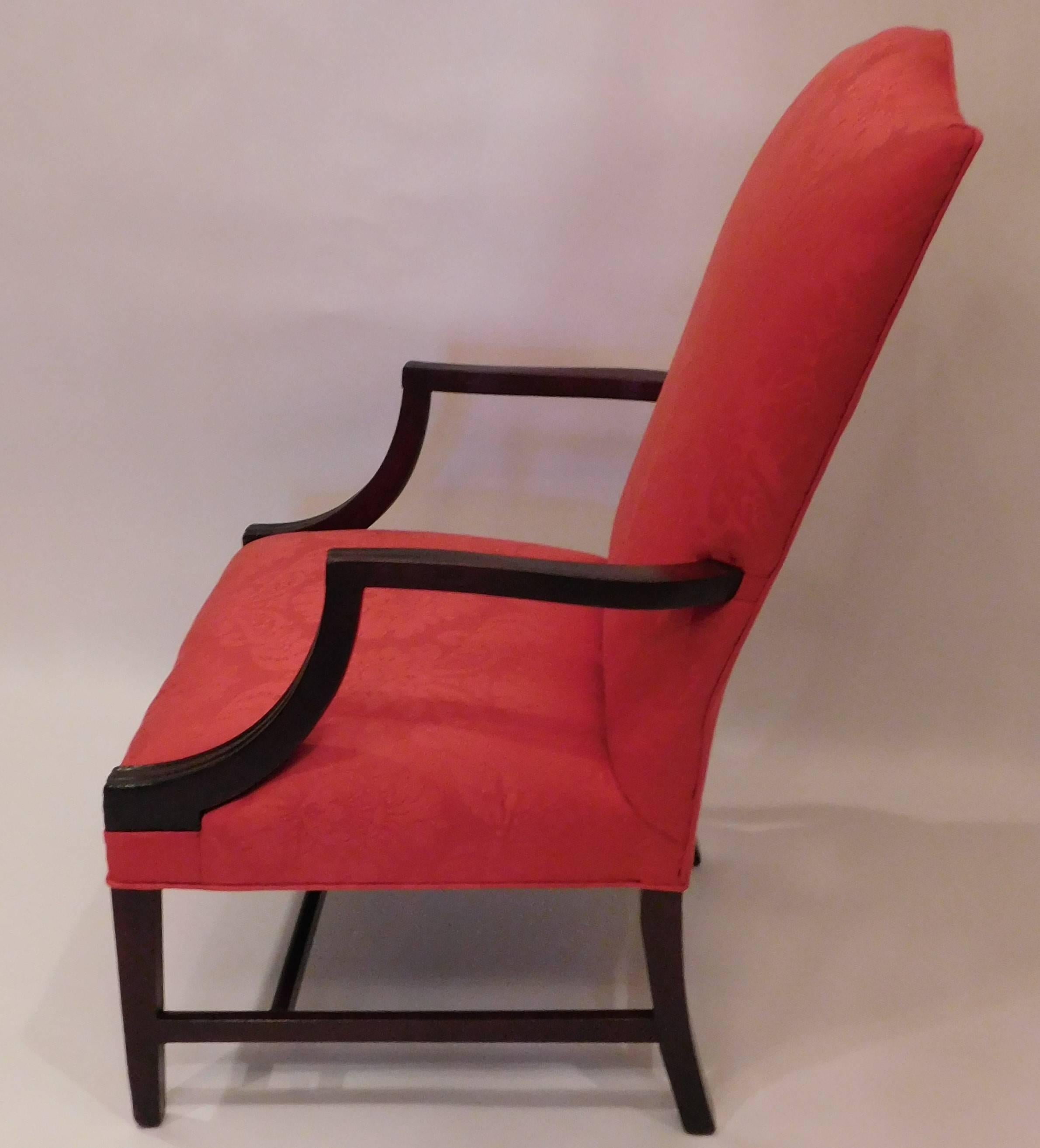 Hepplewhite design with mahogany molded arms and tapered legs, H-stretcher. Newly upholstered in red damask.