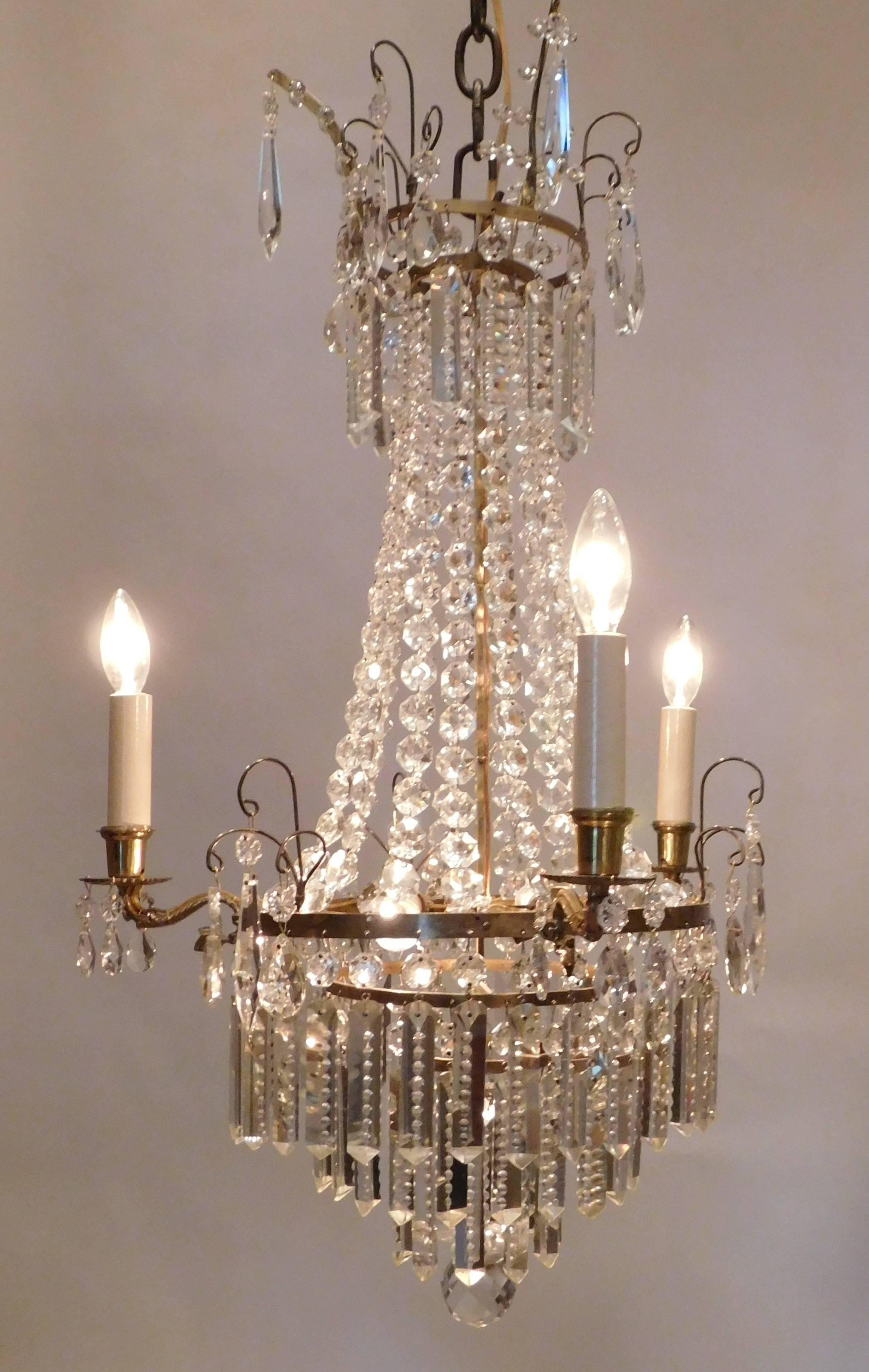Five-light tent and cascade form - three lights on the outside and two on the inside - beautiful notch-cut prisms around base and crown. Chain, hanging hardware and ceiling cap included.