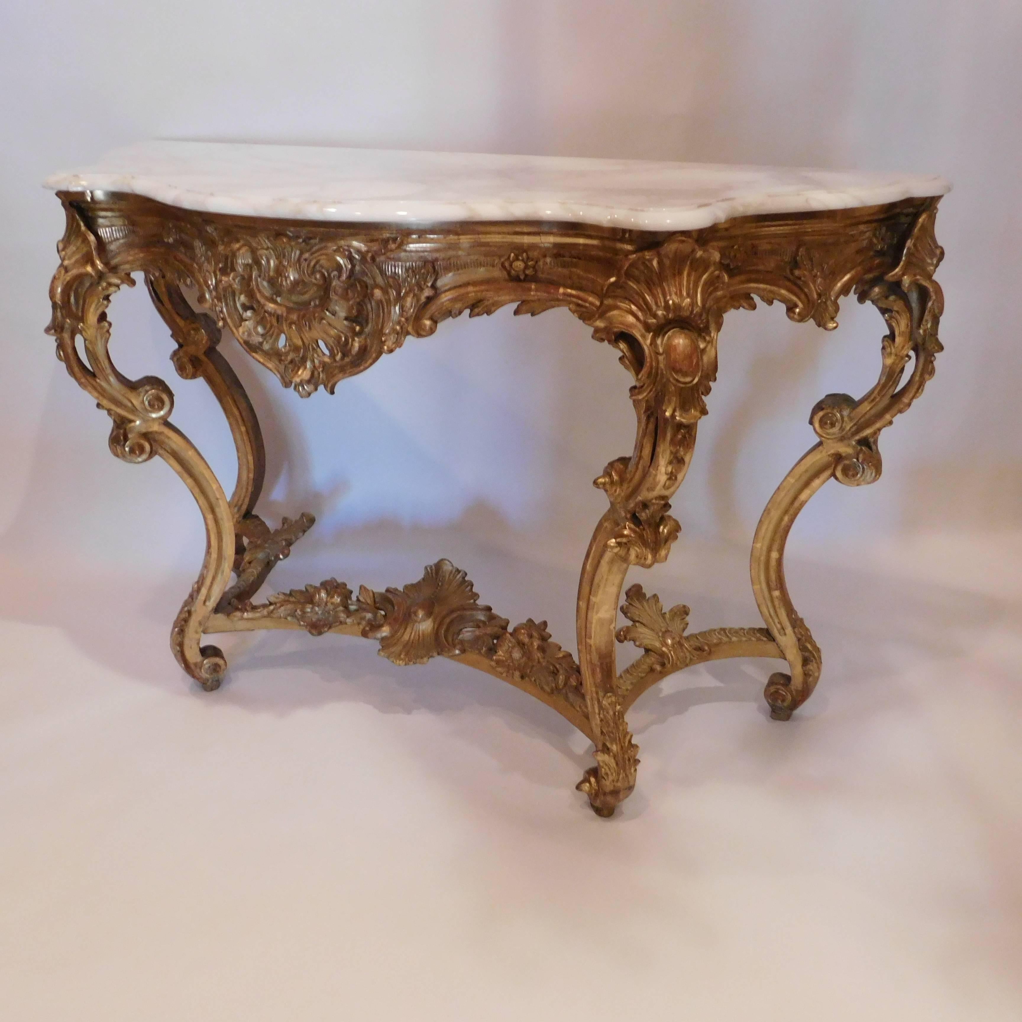 Expertly hand-carved in either Italy or France, gold leaf and gilt. Marble-top was replaced probably 25 to 30 years ago.