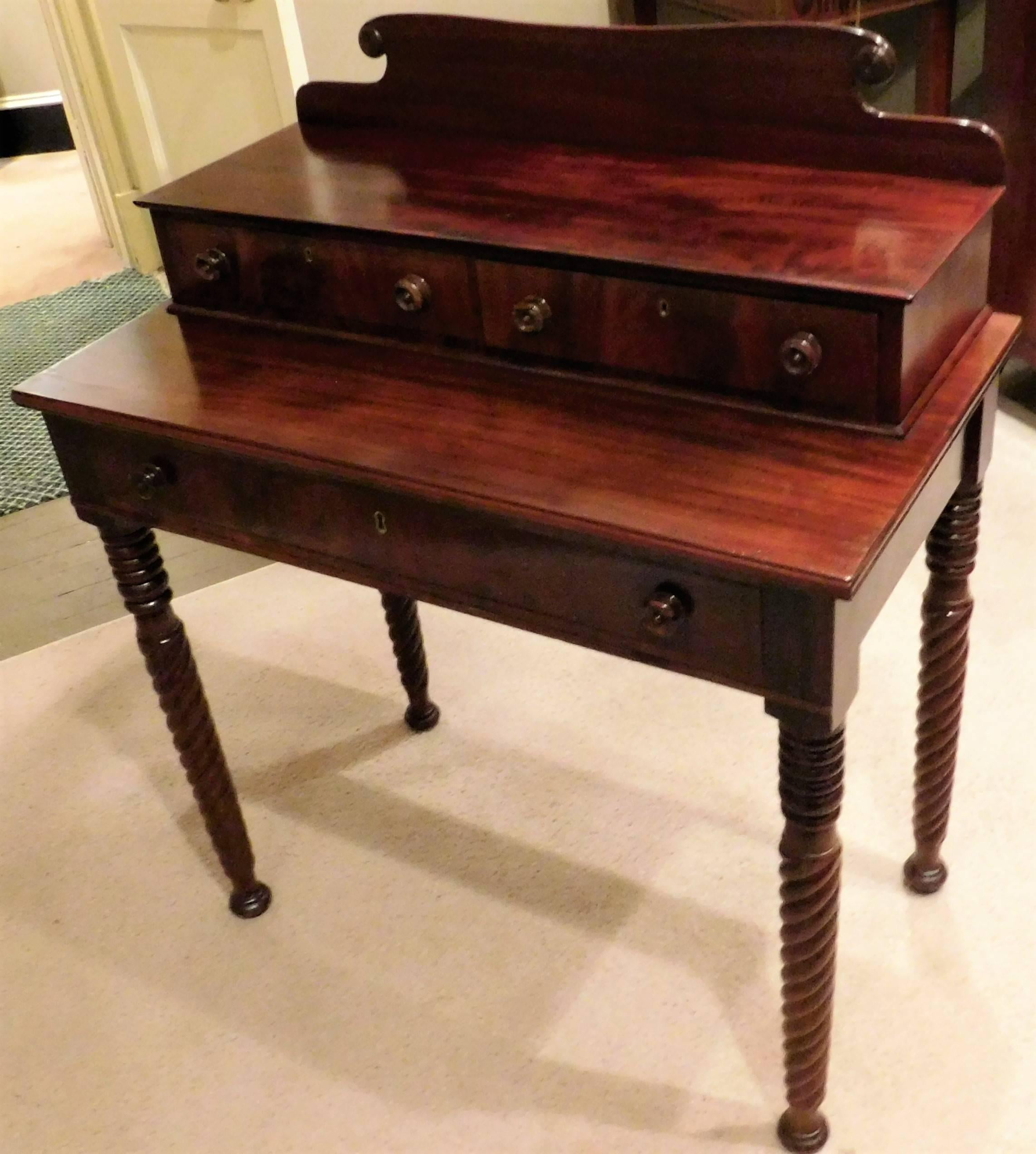 This charming and unusual Sheraton step-back piece has three drawers, mahogany and mahogany veneer with pine and birch secondary woods. The knobs are zebra wood-excellent spiral turned legs, French polish.