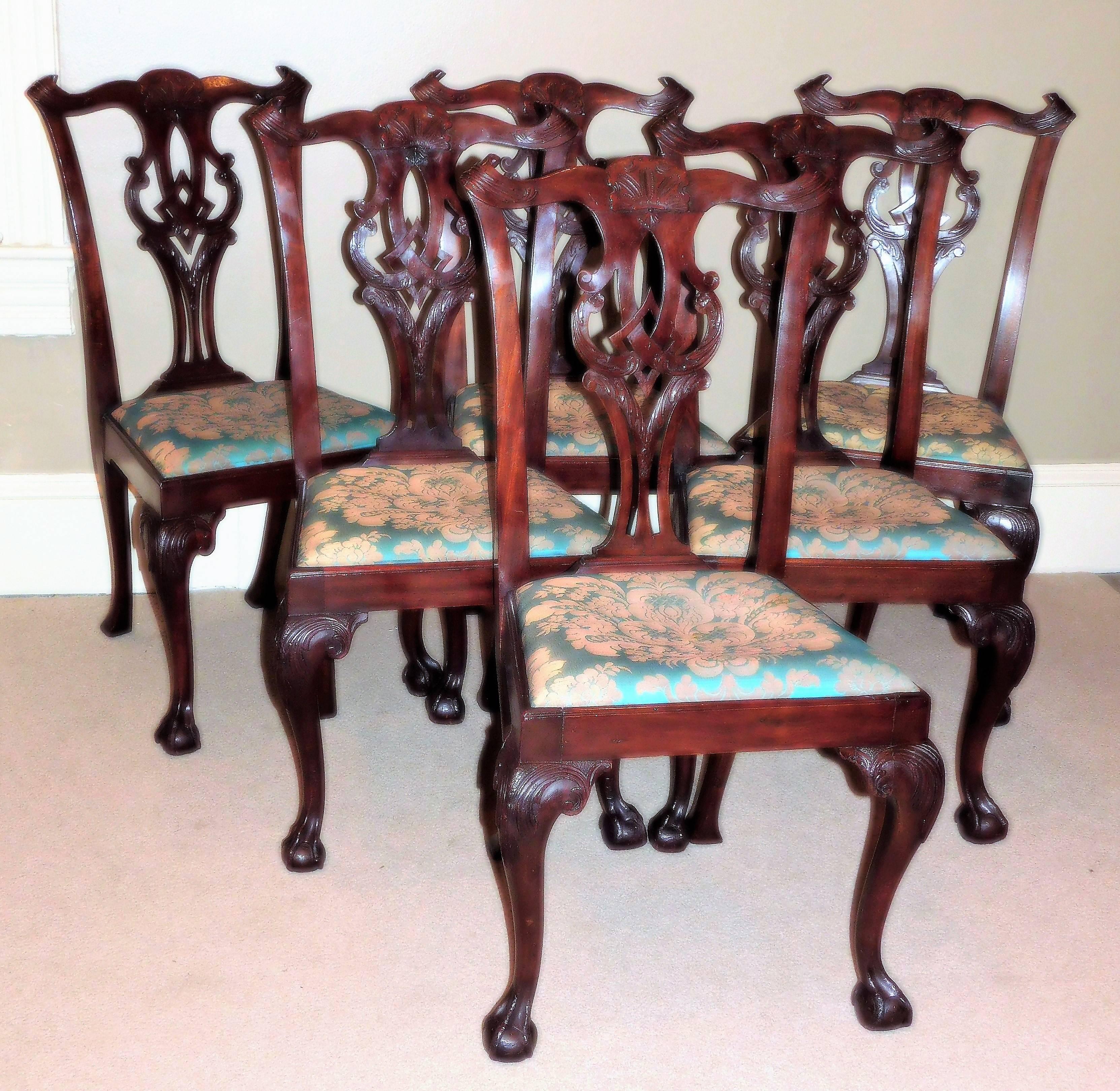 These side chairs are probably American and probably slightly out of period. They are mahogany with pine glue blocks and have excellent carved details. Unusual petite size - original seat frames - restored French polish.
