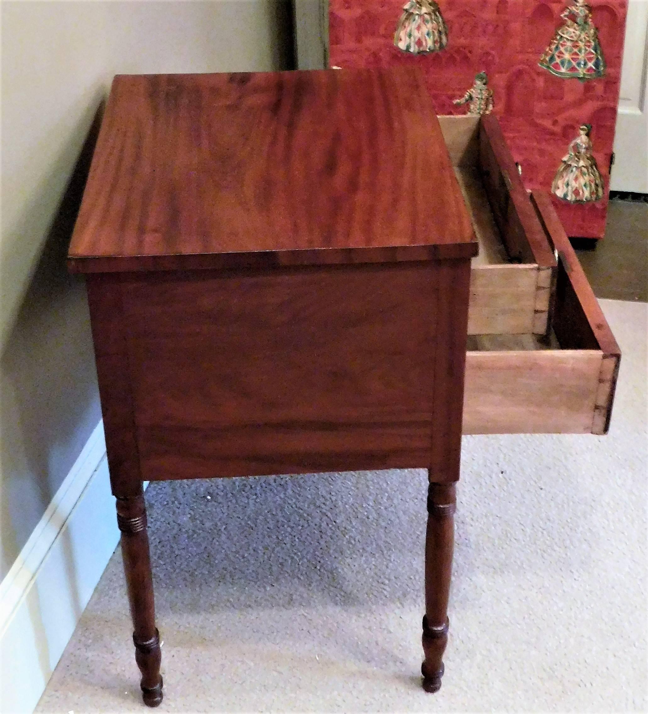 This Mid-Atlantic Sheraton stand is mahogany and mahogany veneer with poplar secondary wood, replaced solid brass pulls, French polish and finished on three sides.