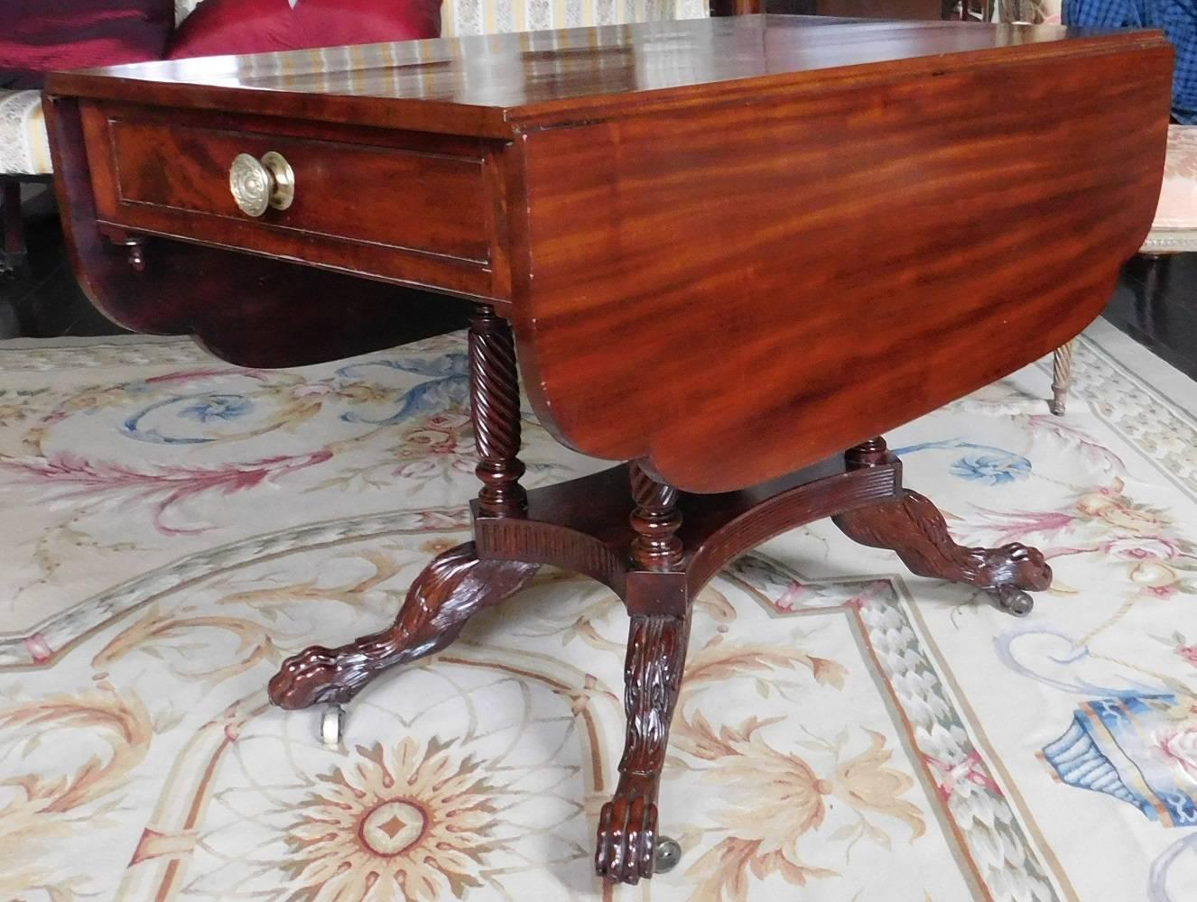 We attribute this piece to the workshop of Duncan Phyfe in New York City. Excellent size for use today as a center table, a sofa table or a small dining table. Shaped drop leaves. One drawer and one faux drawer. All supported by four rope-twist and