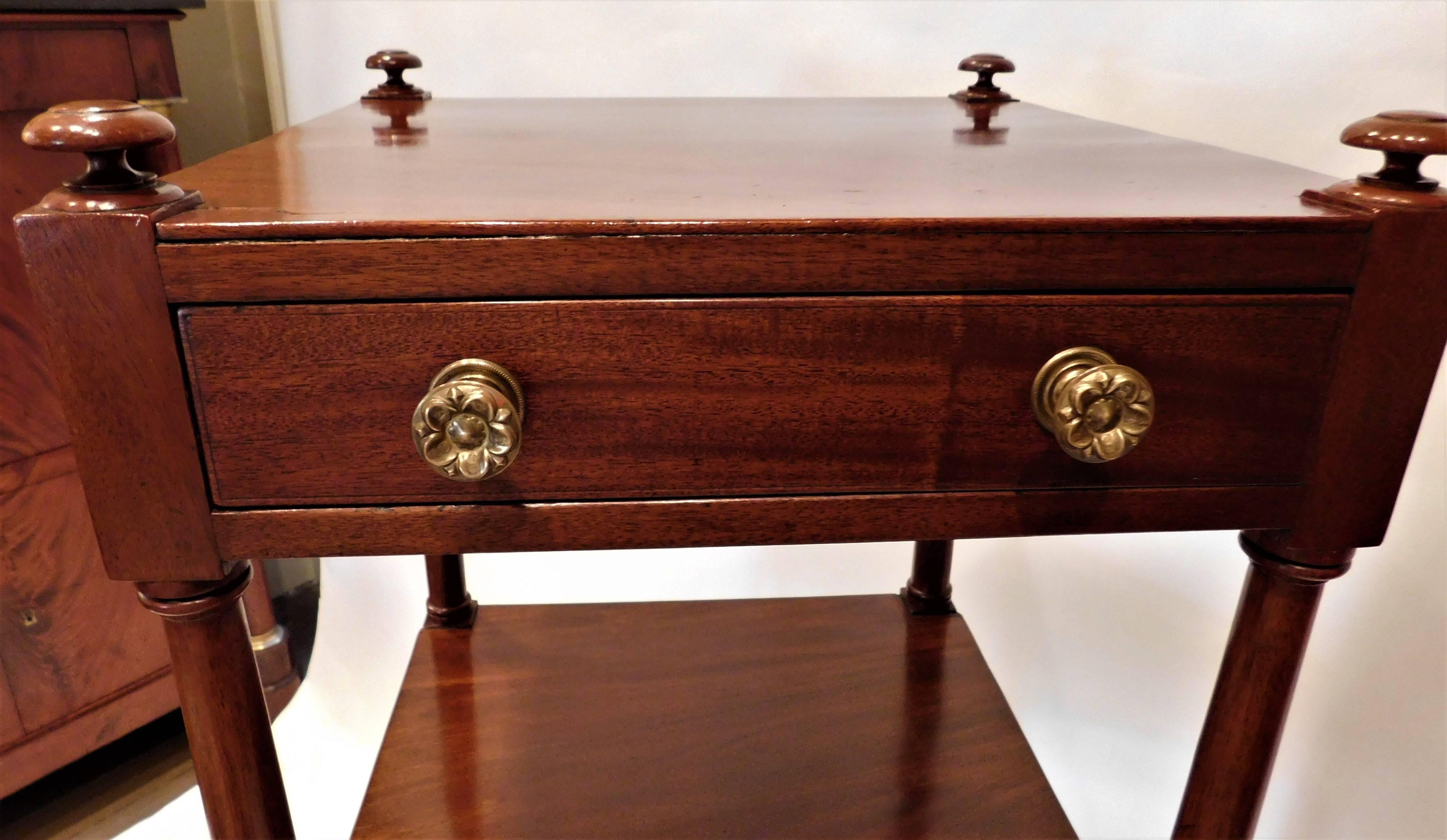 Beautiful old French polish, rich patina. The three drawers make this étagère unusual. Turned finials, hand-turned Tuscan columns. Mahogany with English oak secondary wood, original brass cup castors, replaced ormolu pulls.