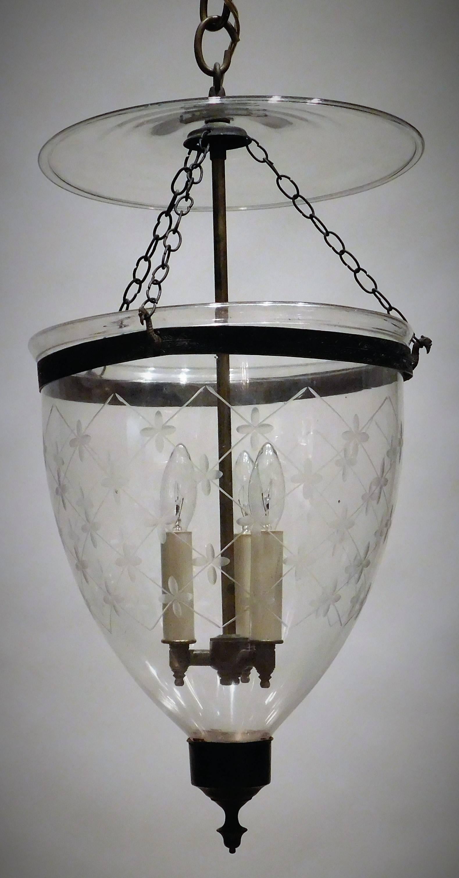 This neoclassical hand-blown and etched lantern has it original aged brass fittings including finial. Originally it held one candle but we have electrified the lantern with a three-light solid brass insert, patinated to match the original brass ring