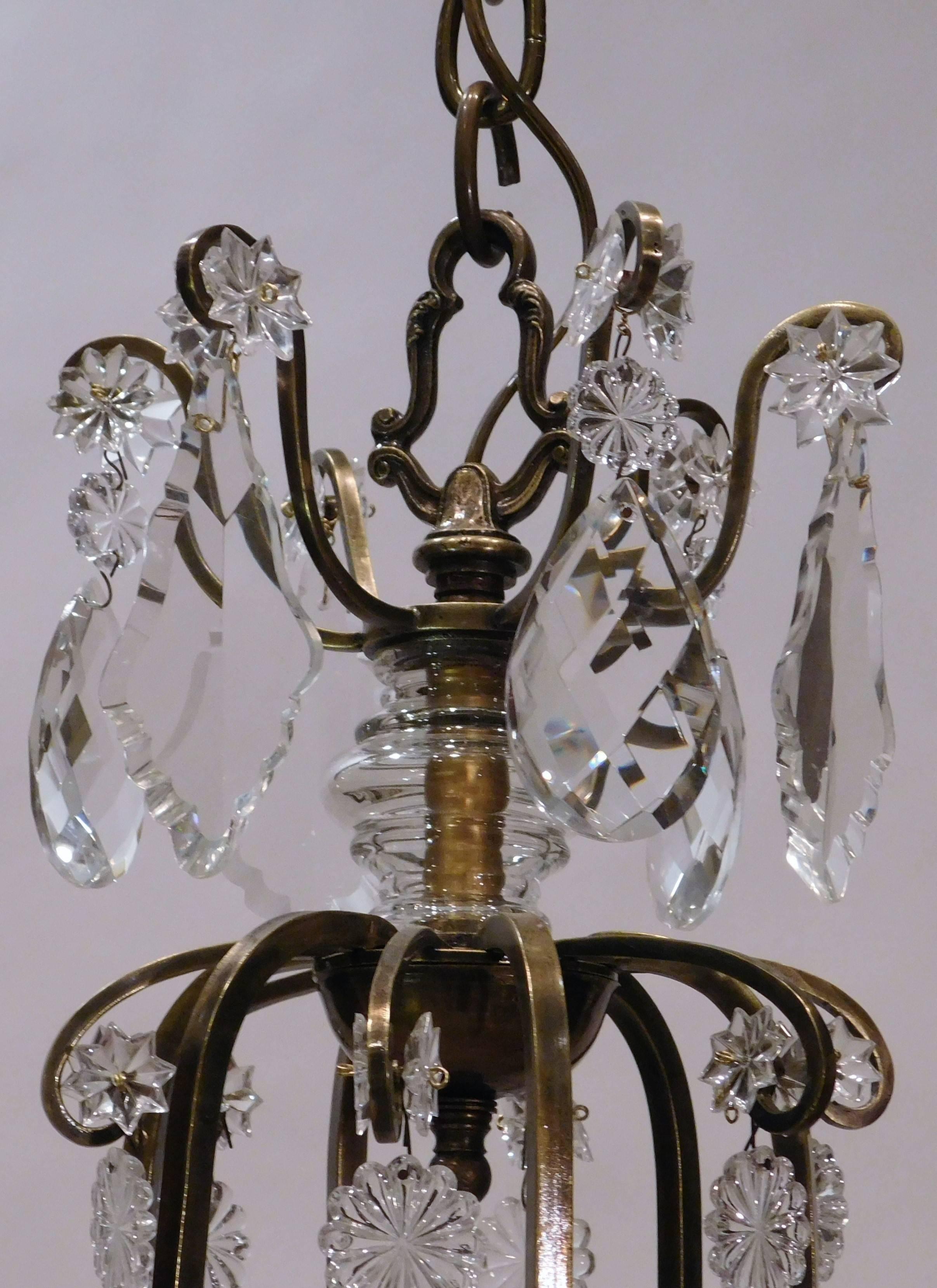 French Louis XV Style Aged Brass and Crystal Six-Light Chandelier, France, circa 1930 For Sale