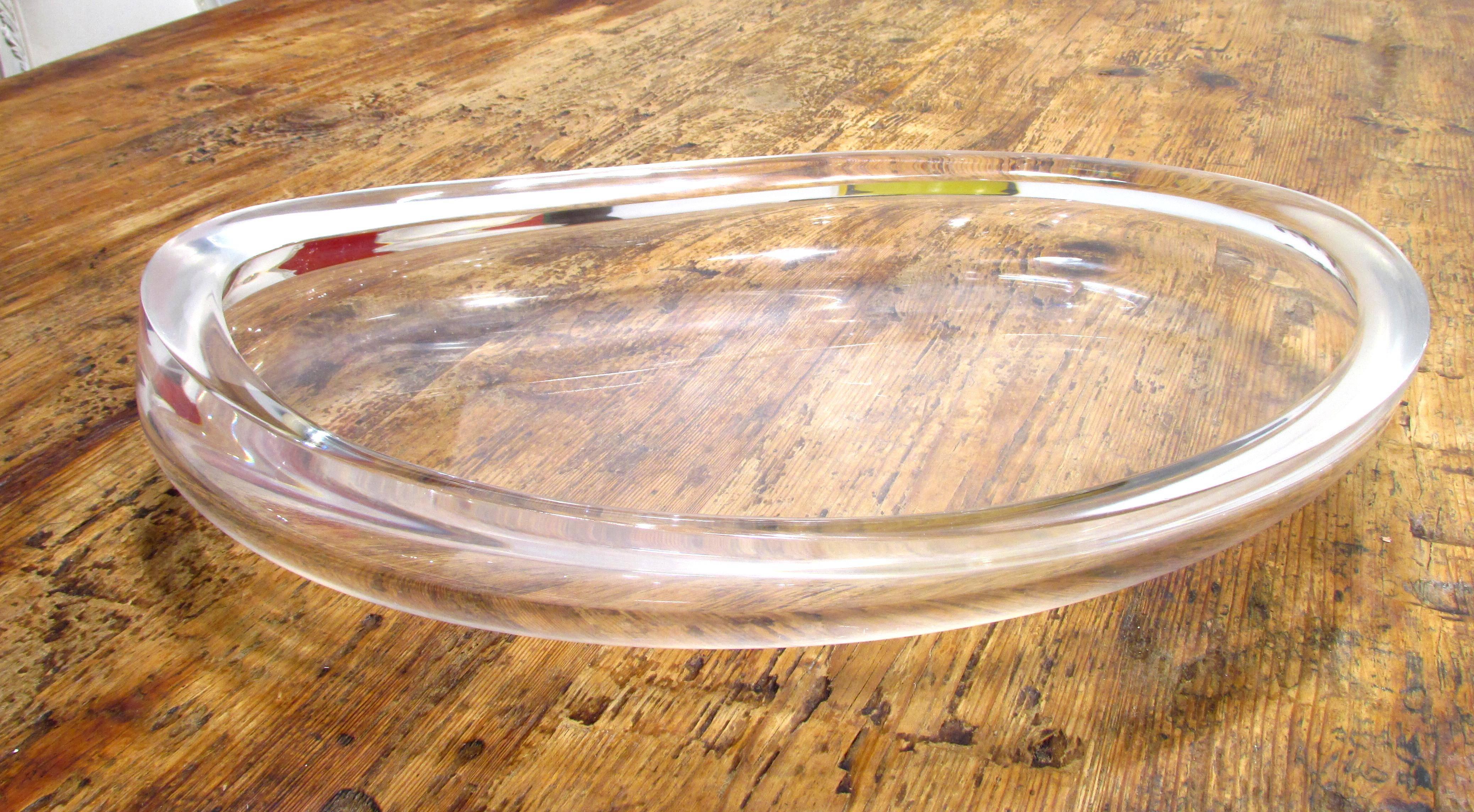 Large thick Lucite bowl in oval shape.
