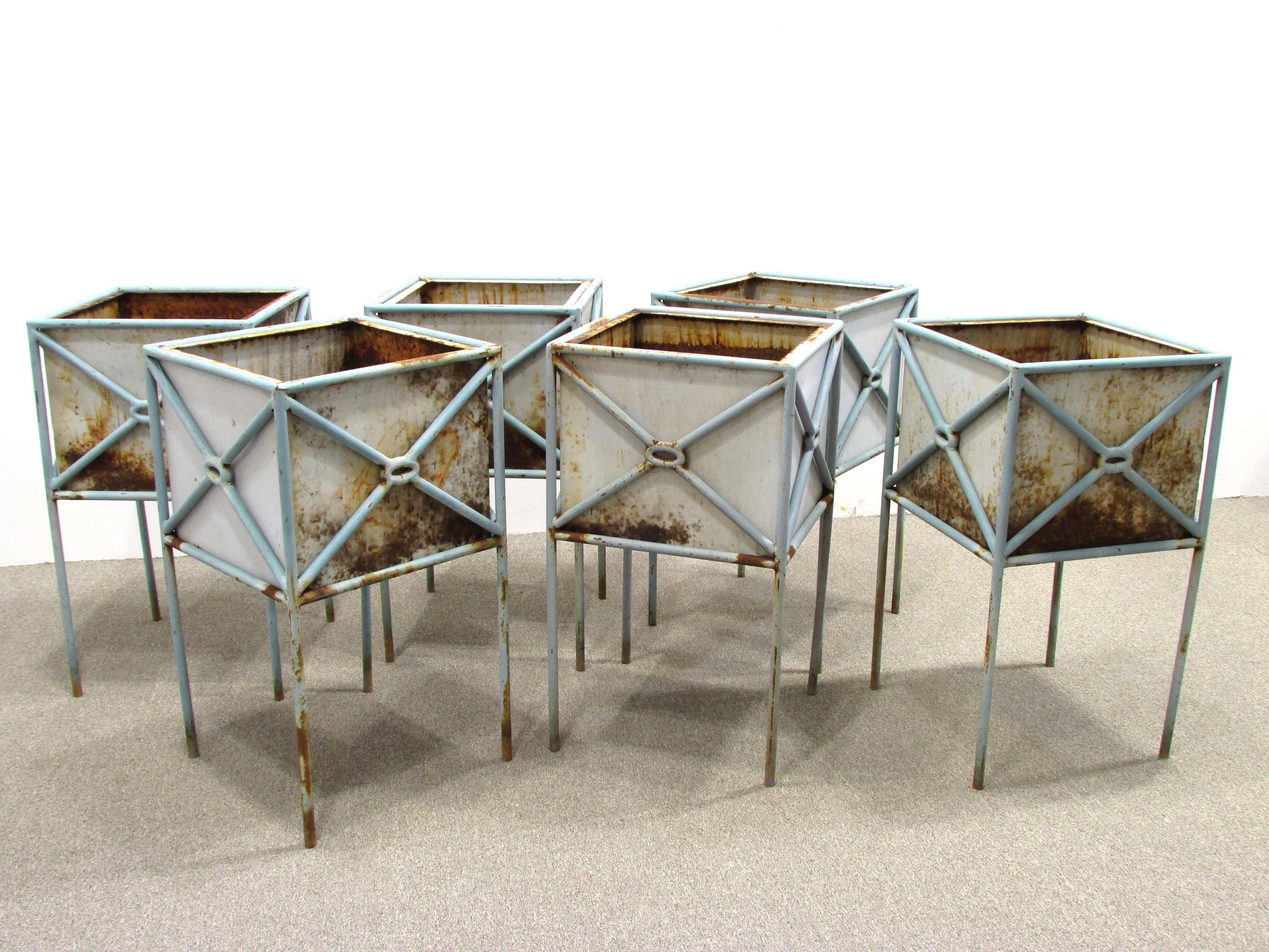 Set of six custom-made planter boxes from the 1980s. Site designed by architect for around a pool in McLean Virginia. Inner box inserts into stand.