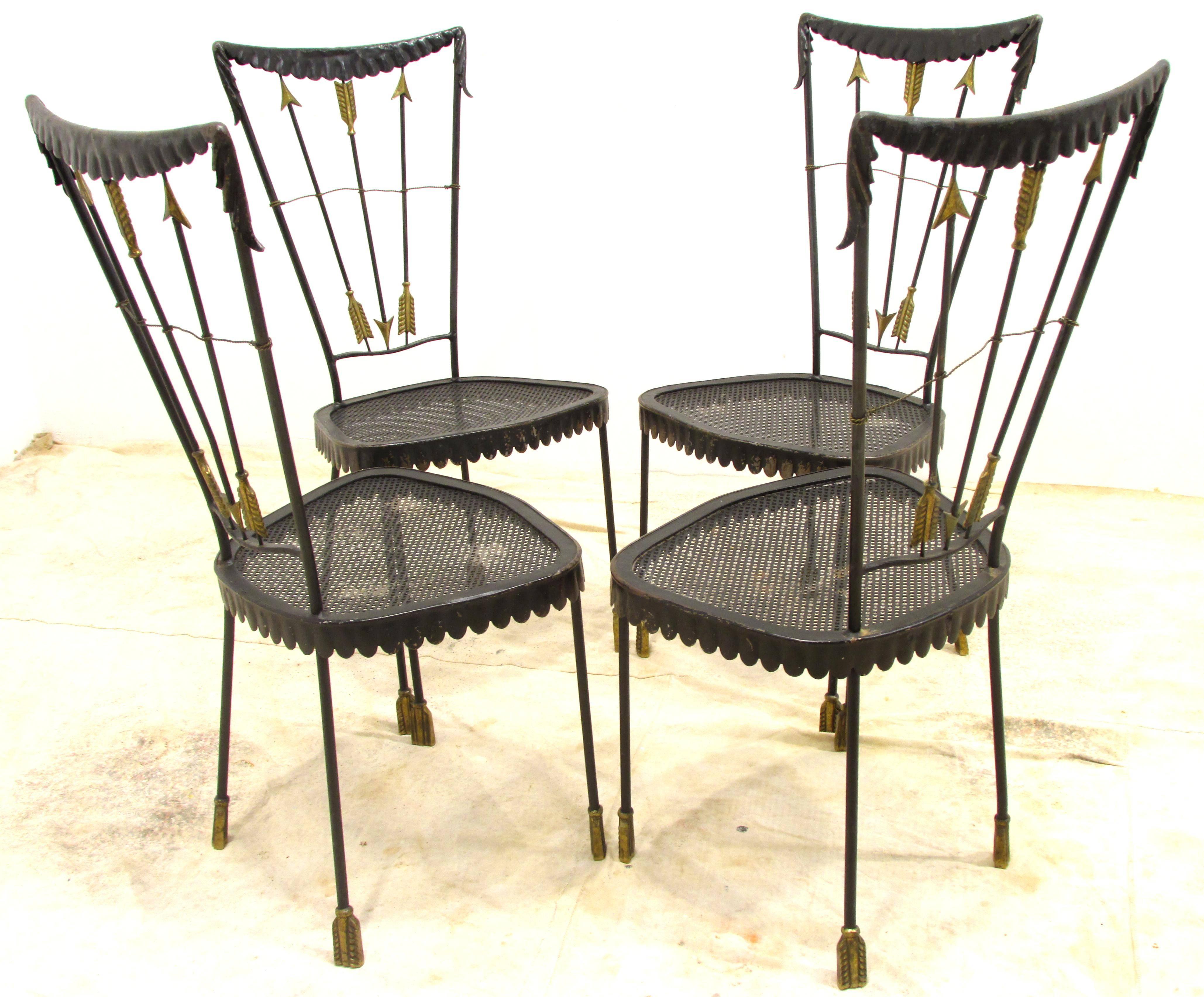 Set of four neoclassical style chairs painted metal with brass arrow motif accents by Tomaso Buzzi.