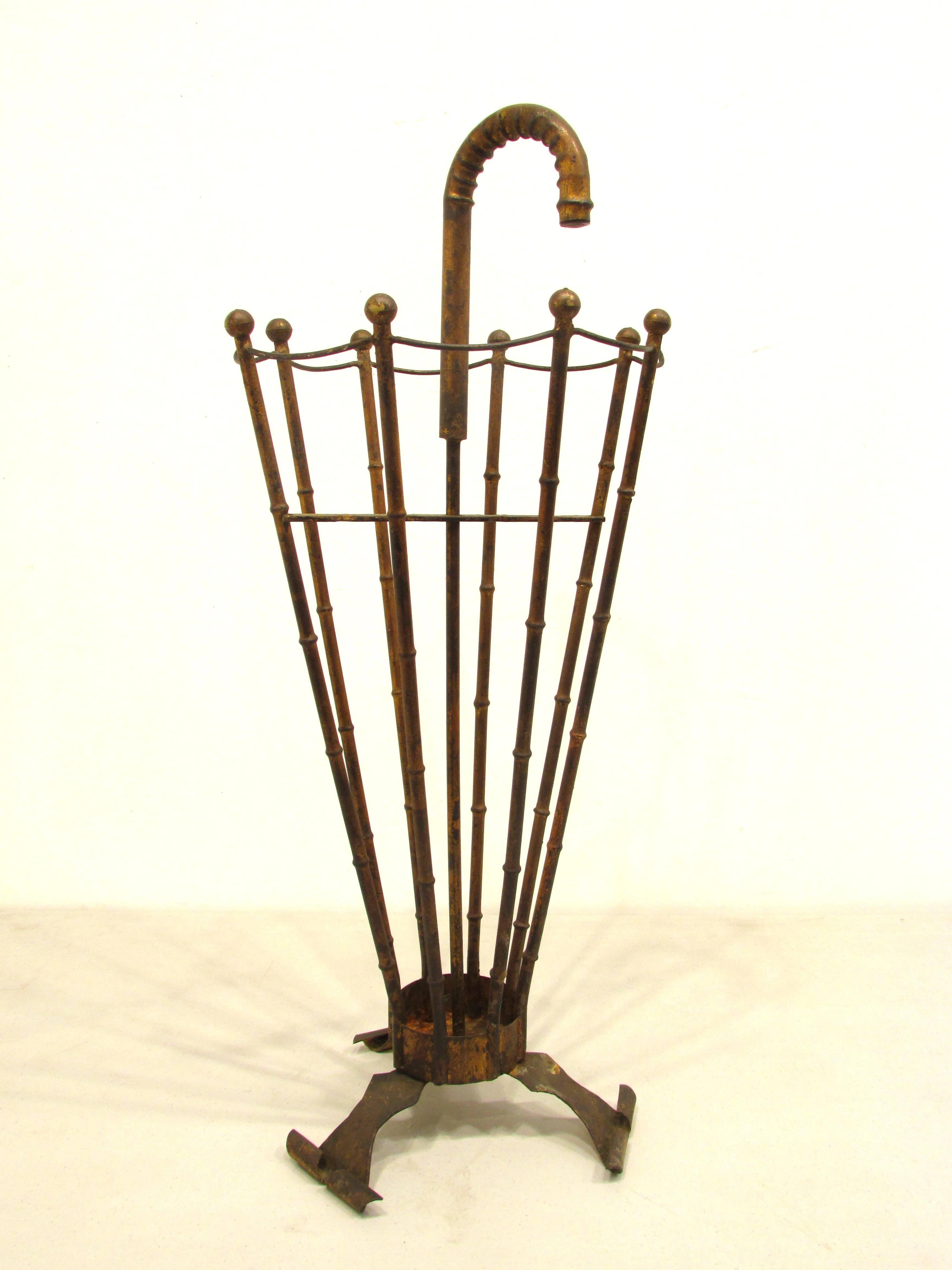Very surreal umbrella stand resembles a umbrella made of faux bamboo gilt metal with realistic handle from Italy.