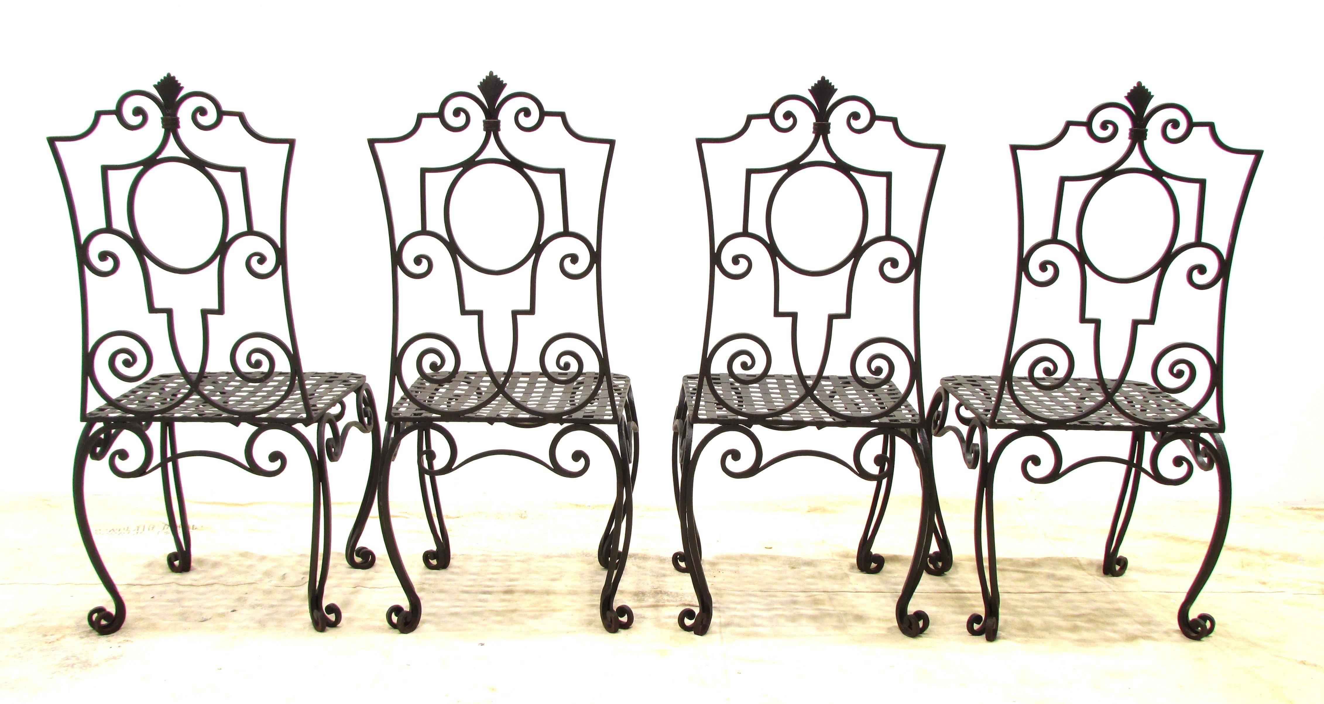 Set of four handmade wrought iron chairs in the style of Jean-Charles Moreux.