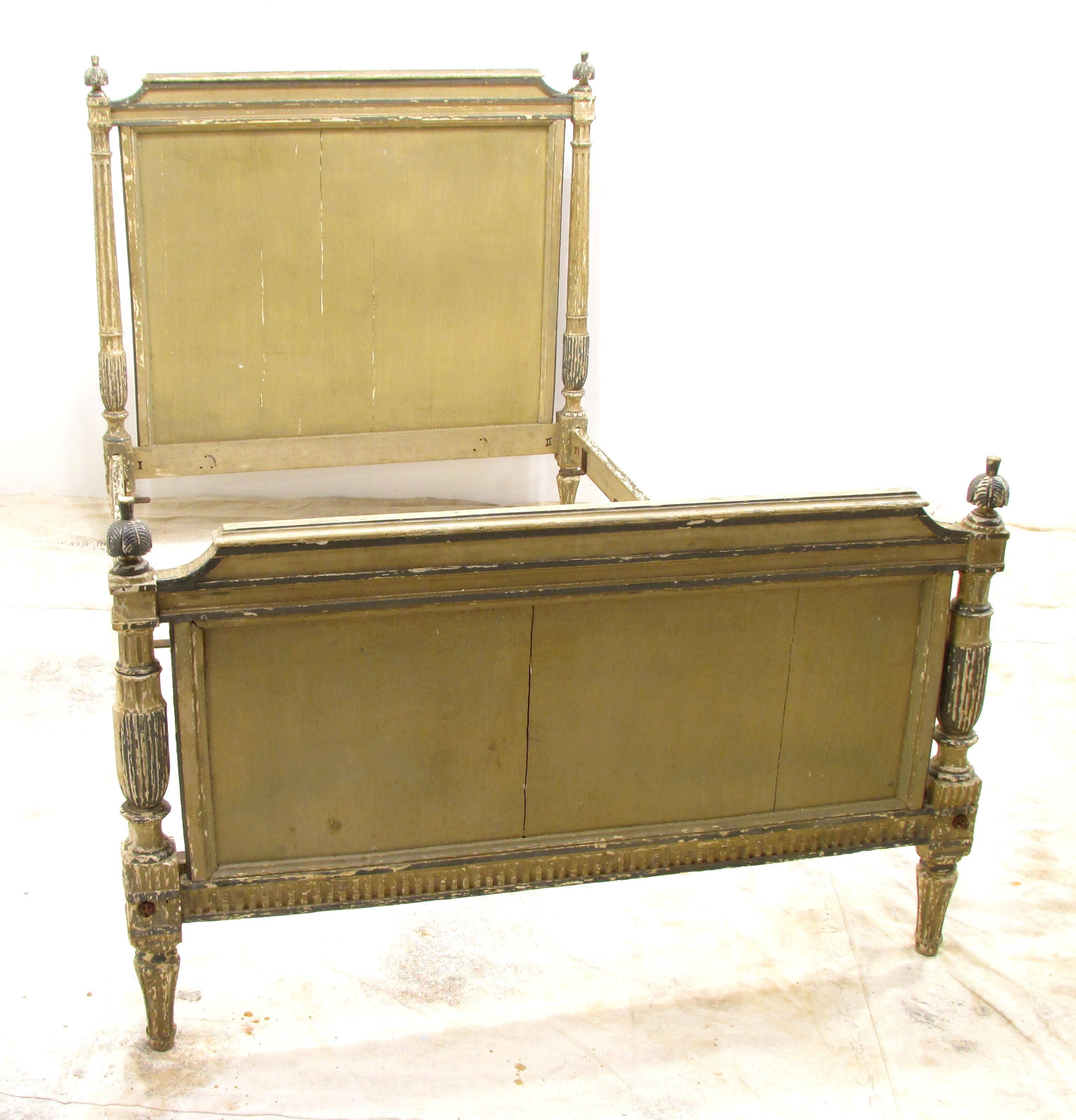 French Louis XVI  directoire bed "small double" size with original green paint with detail carved finials and turned receded columns and legs and fluted rails dates from early 19th century the rails have been extended to accommodate a 3/4