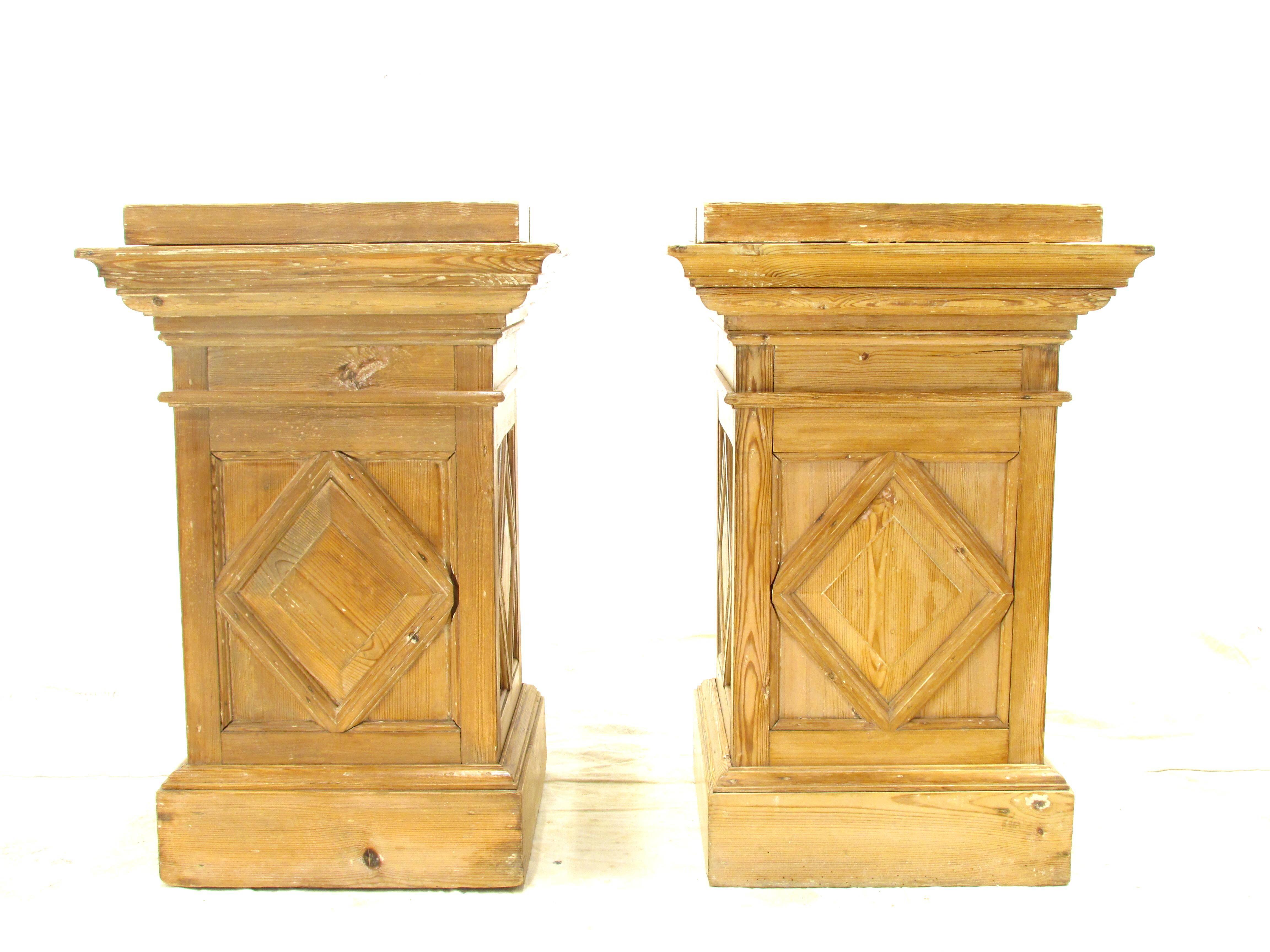 Beautiful pair of weathered and worn architectural detailed wooden pedestals or sculpture stands.