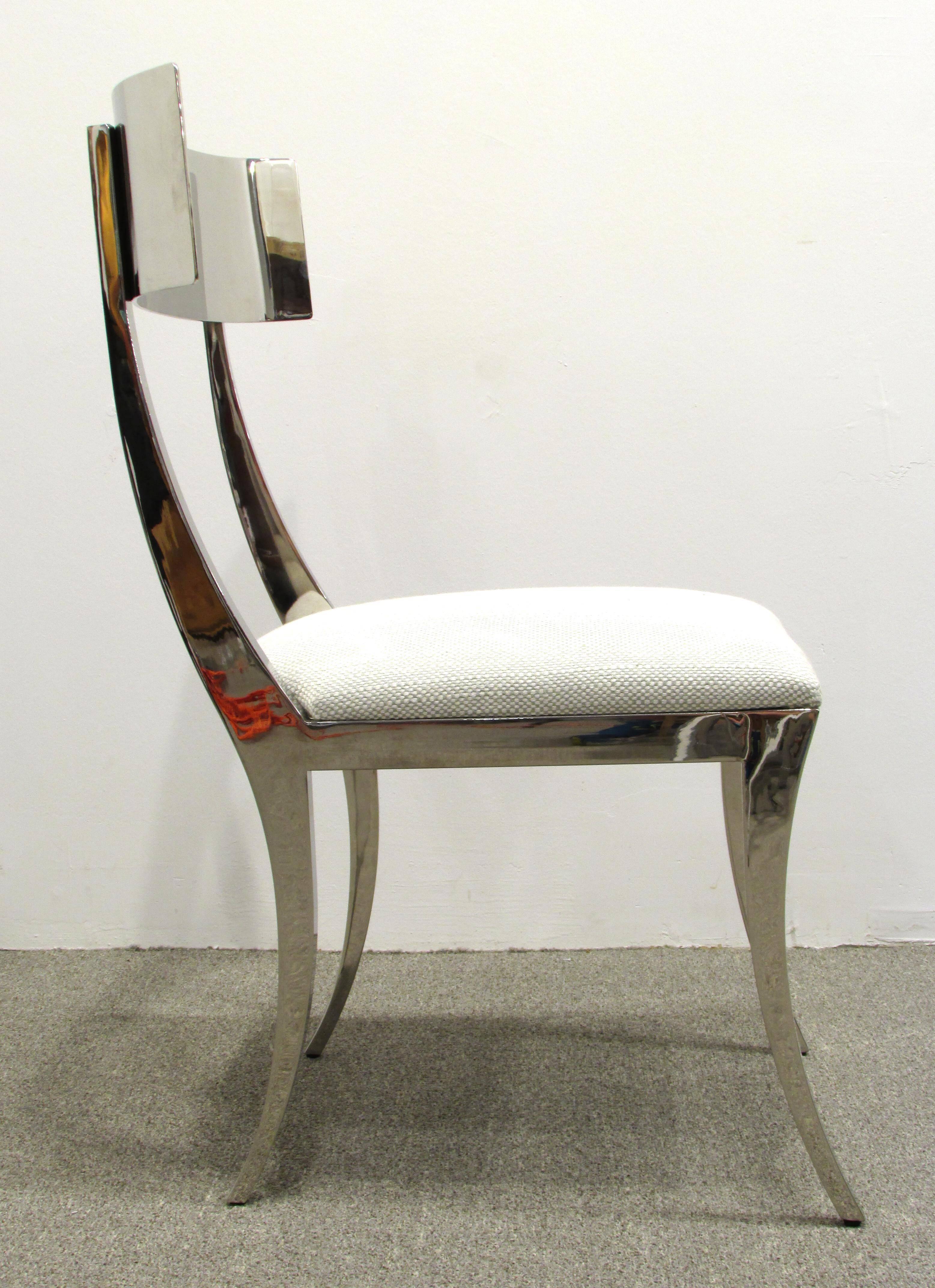 Very sleek polished chrome Klismos framed chair with upholstered seat.
