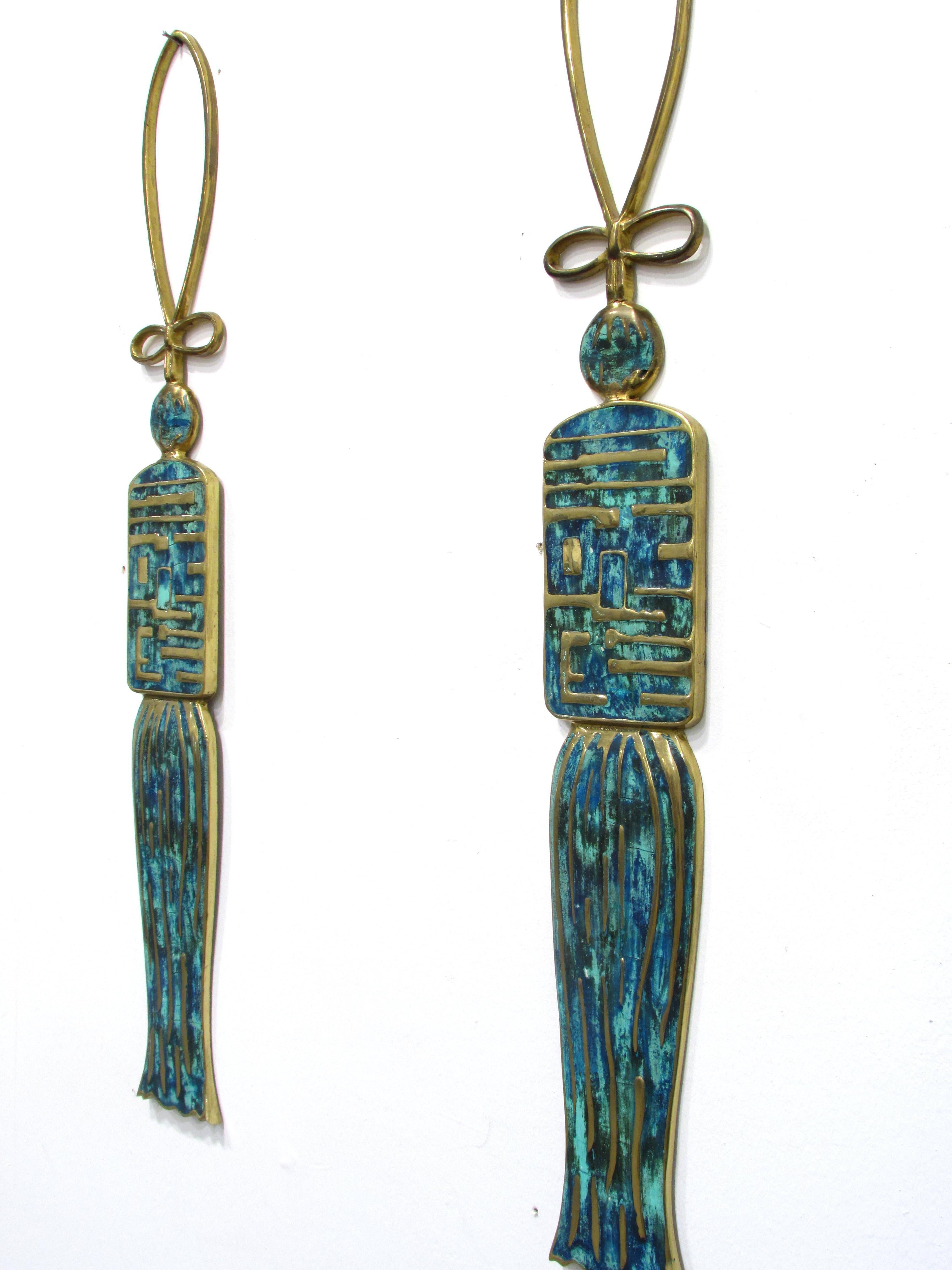 Pair of cast brass and enamel hanging ornaments in the shape of large tassels.