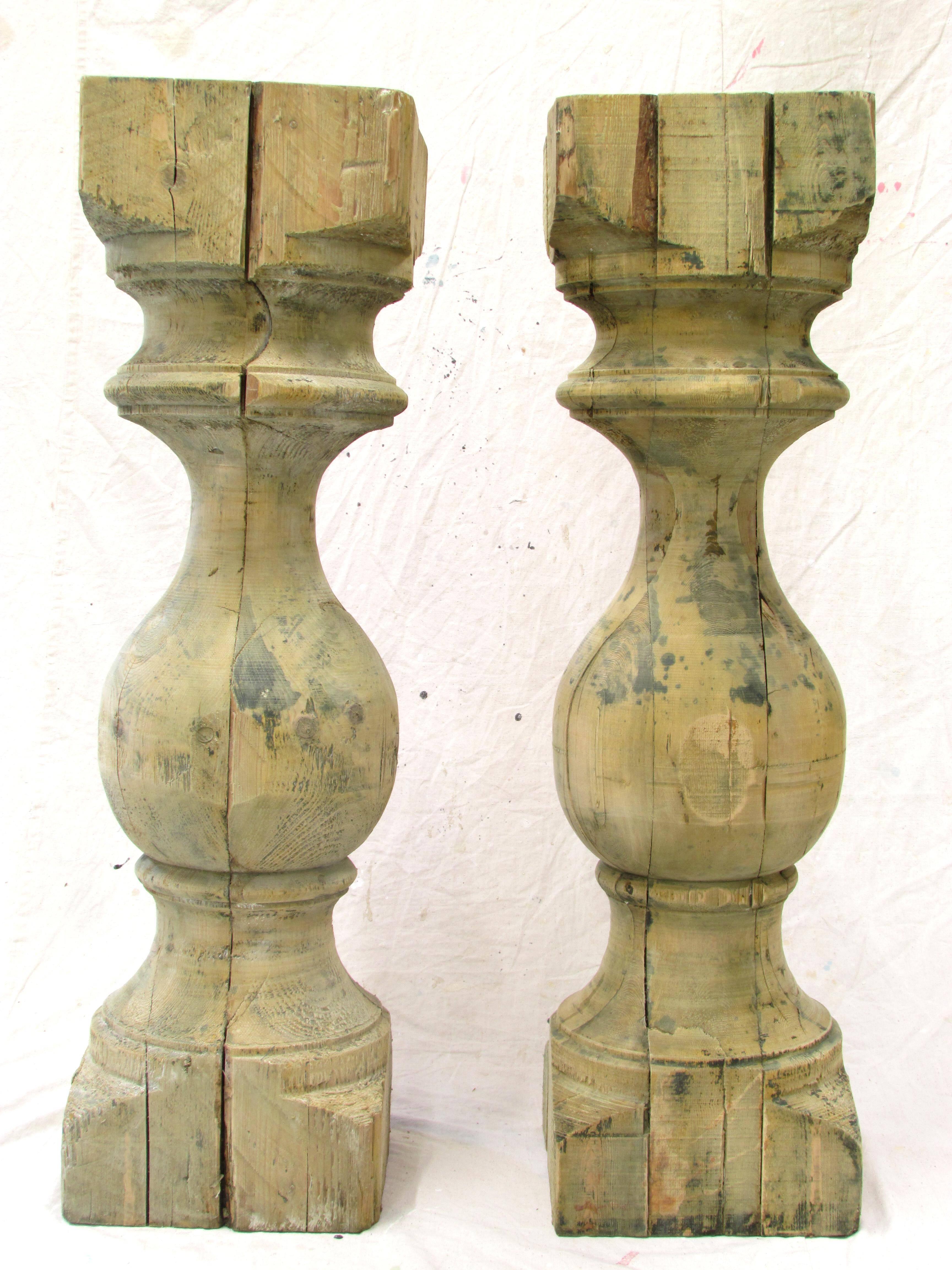 Two large-scale turned stripped pine wooden baluster could be used as pedestals