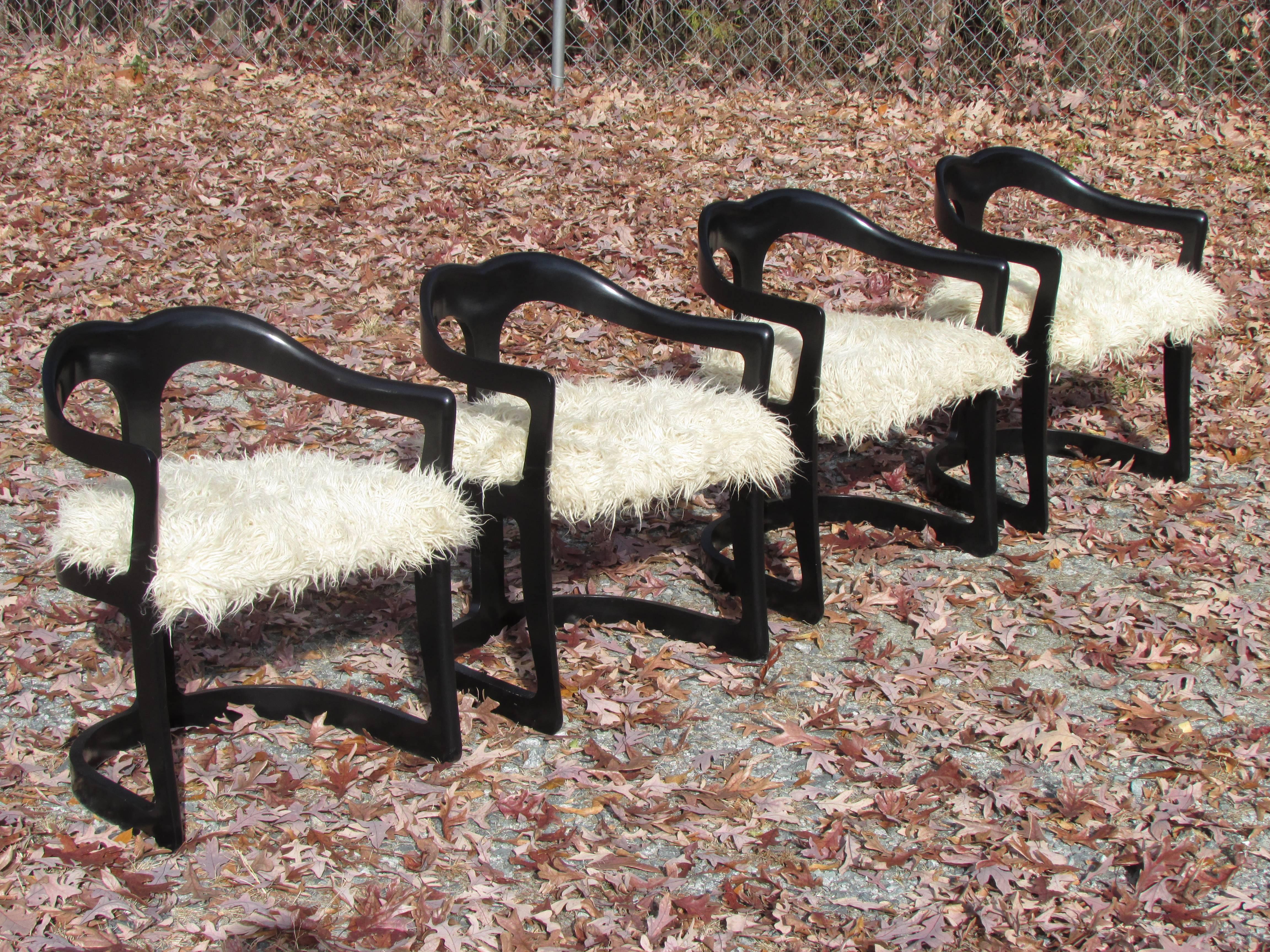 Set of four black enameled chairs with rounded backs with flokati upholstered seats by Broyhill.
