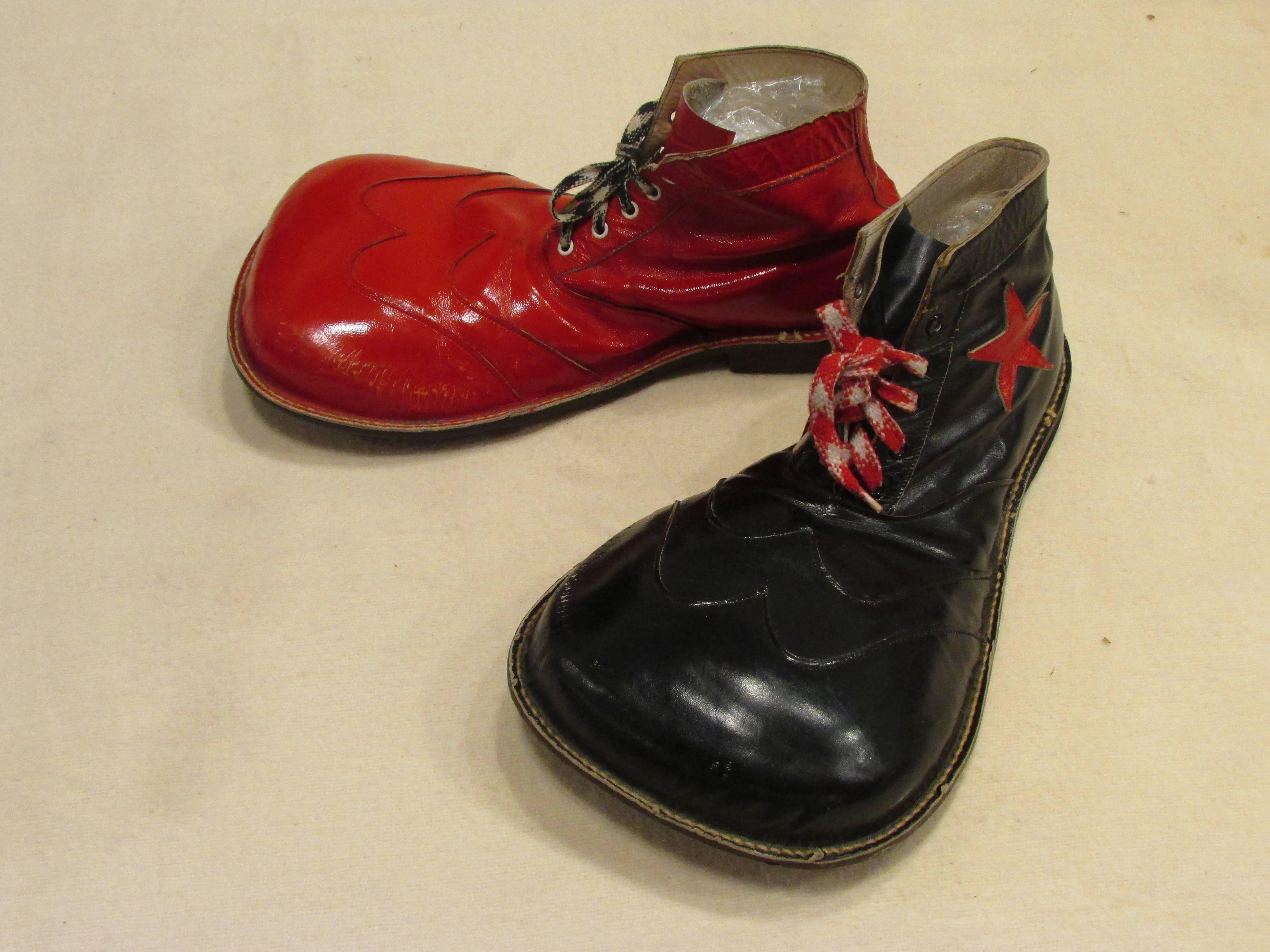 Pair of vintage red and black leather clown shoes each with applique star and man-made soles
From my collection of vintage Clown Shoes