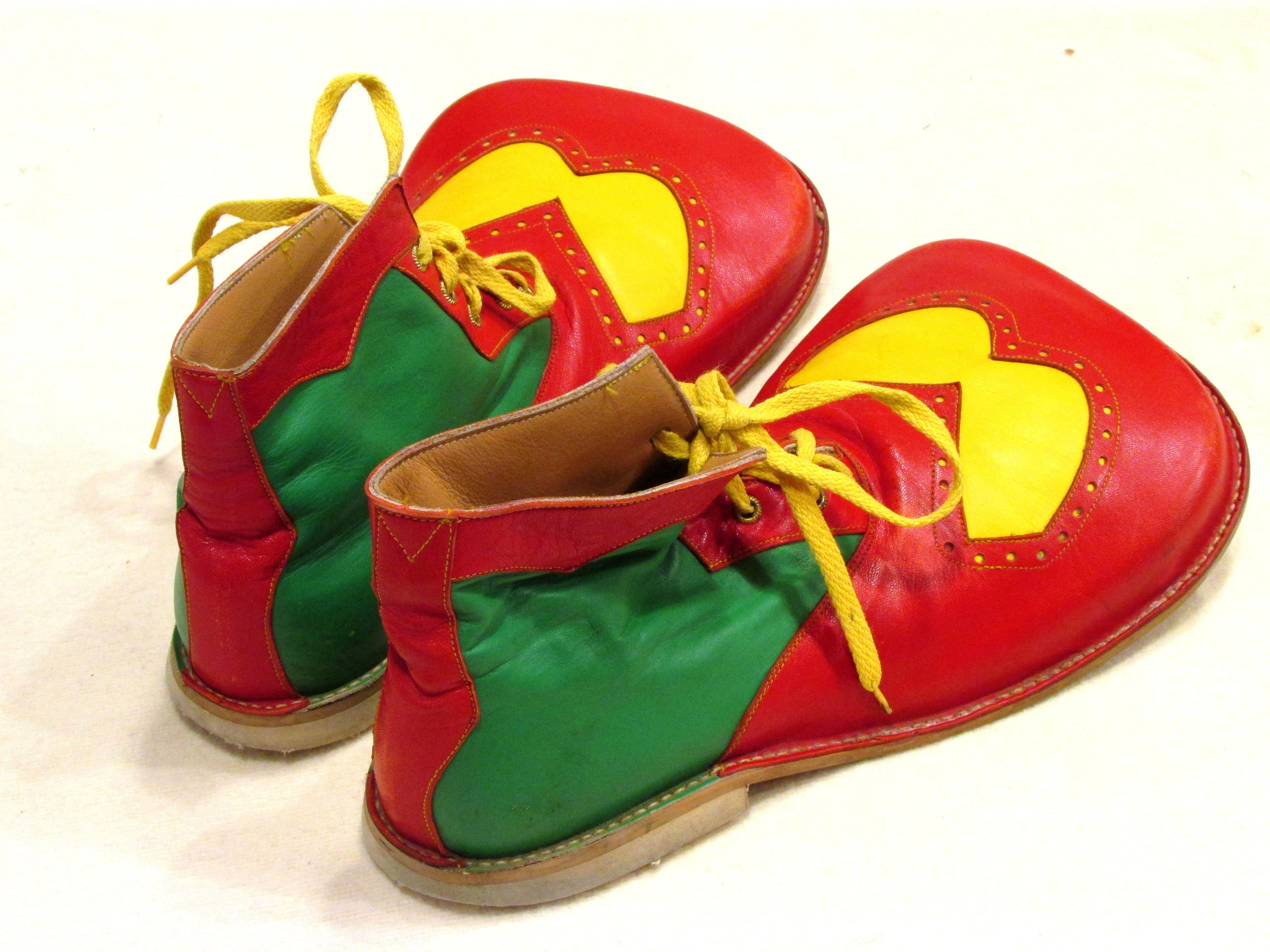 Big pair of red yellow and green leather clown shoes with big wide toes and man-made soles
From my collection of vintage Clown Shoes