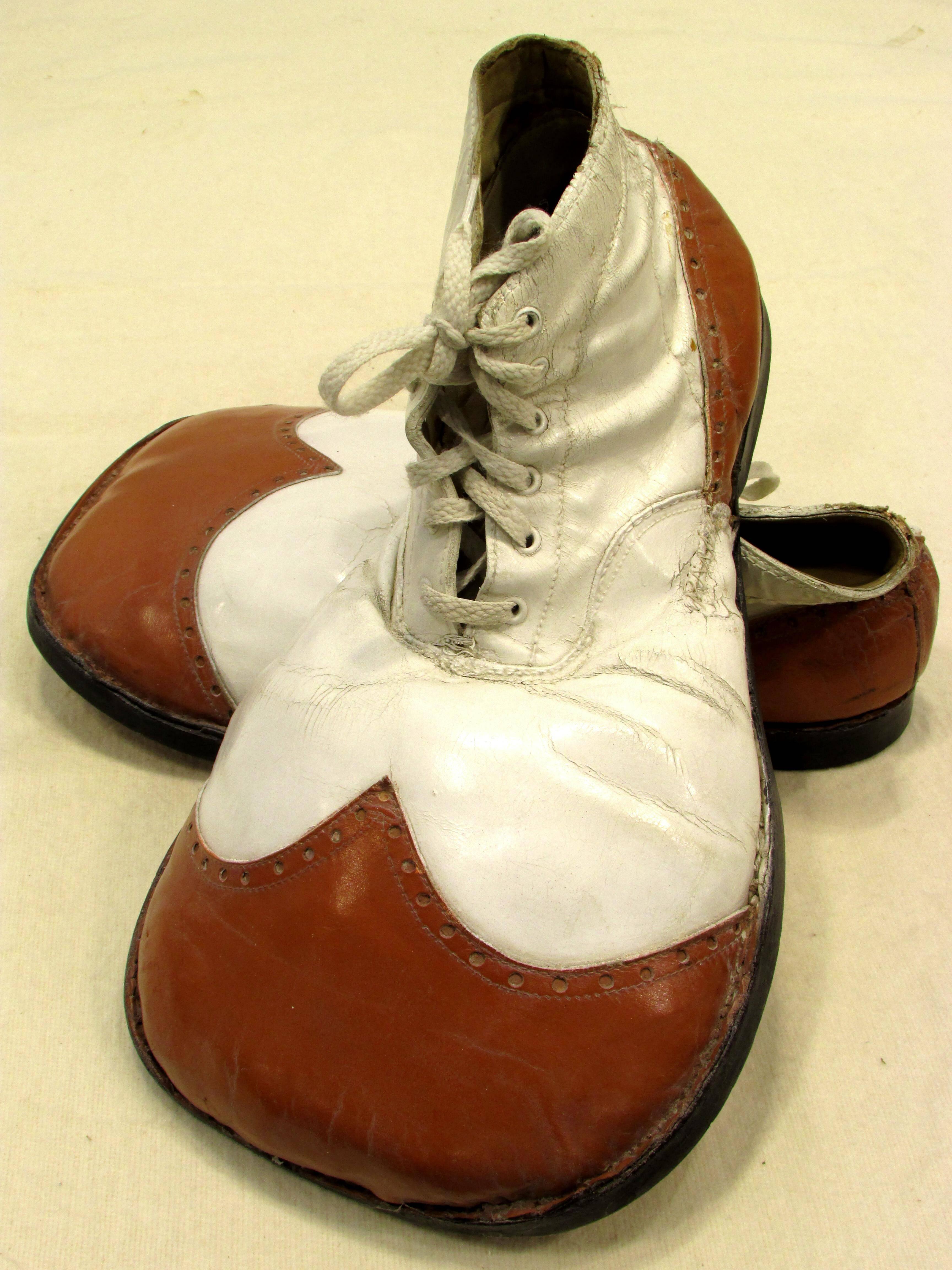 Pair of vintage big toed red and white clown shoes with leather and rubber sole
From my collection of vintage Clown Shoes