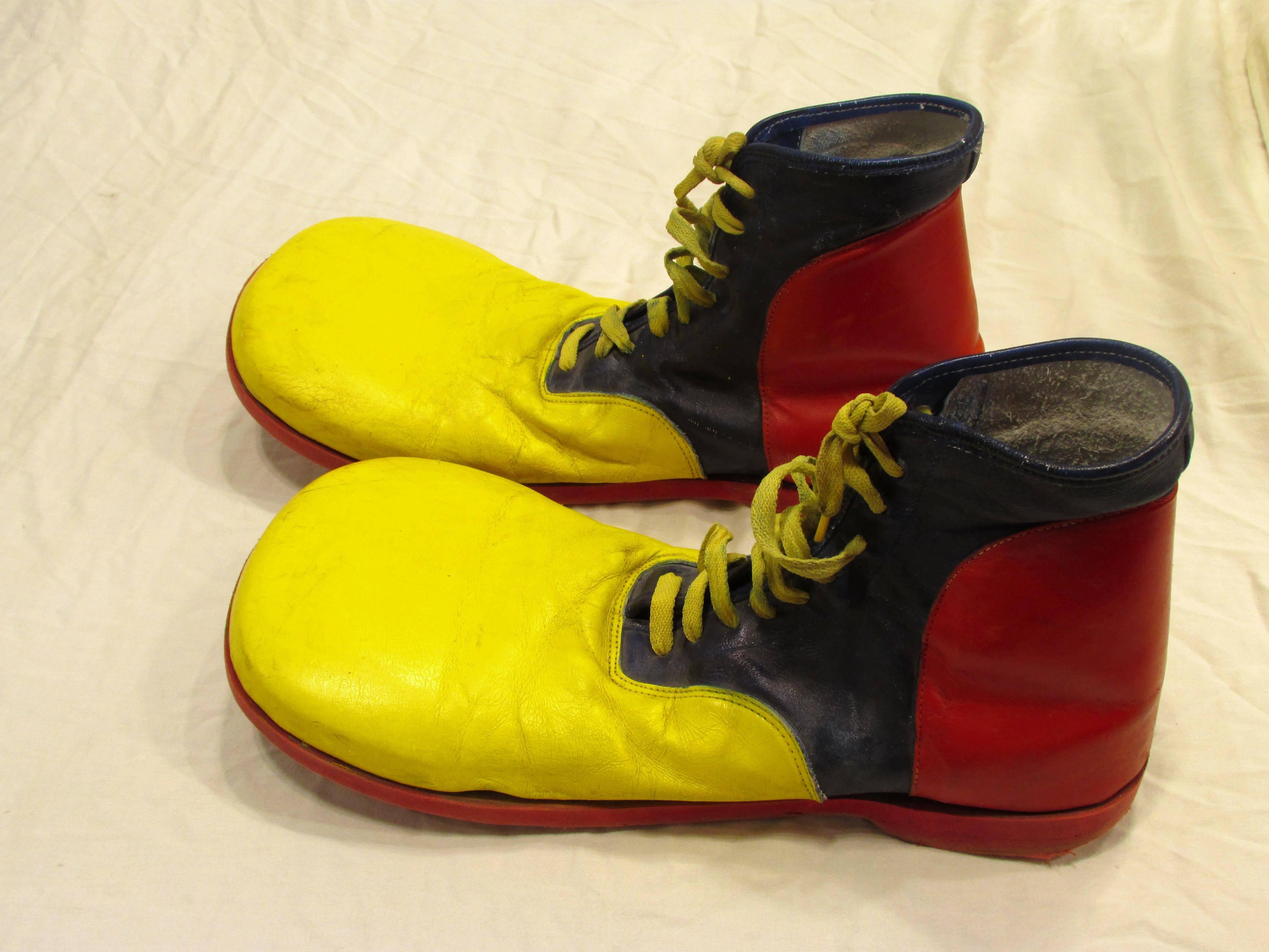Pair very colorful clown shoes yellow blue and red leather with red synthetic sole and yellow laces
From my collection of vintage Clown Shoes.