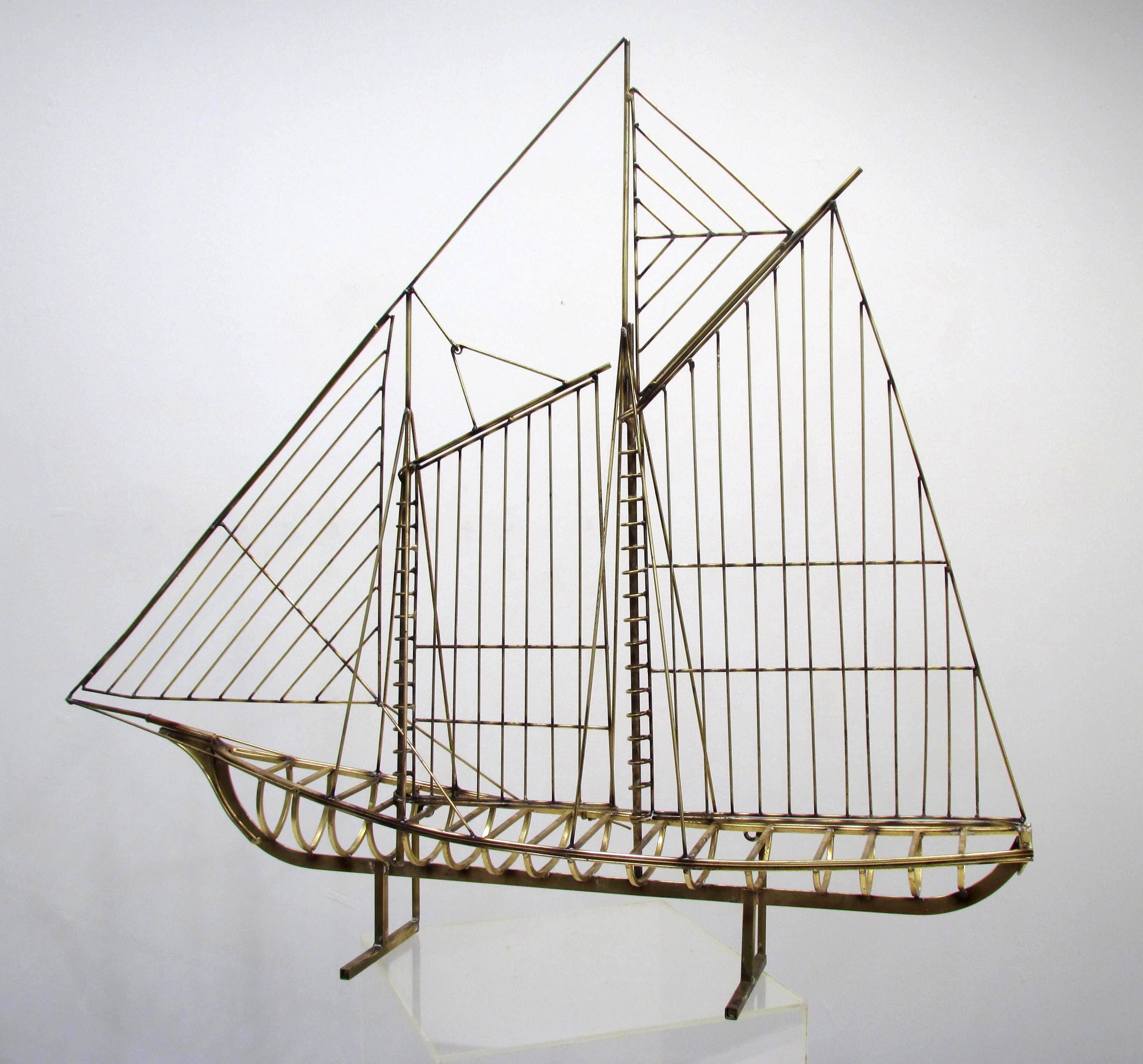 Large ship made with several different sized and shaped brass rods can set or hang signed 