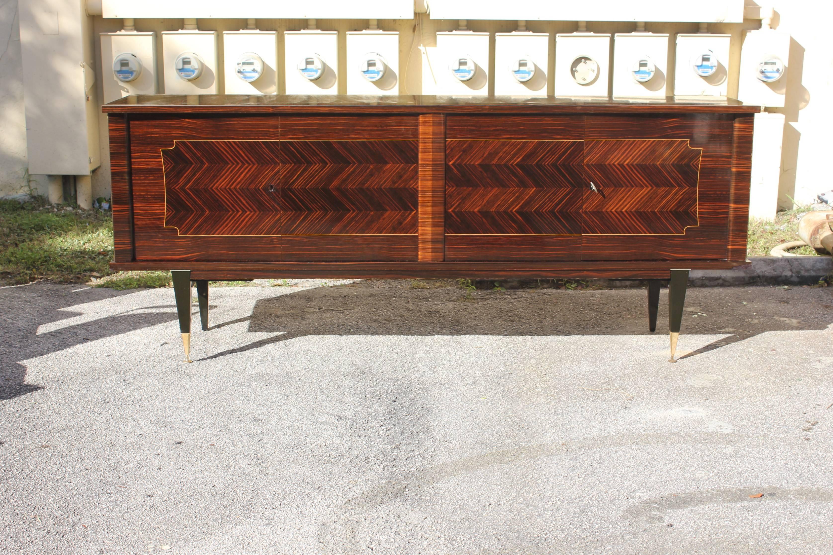 French Art Deco exotic Macassar ebony sideboard or buffet in perfect condition, circa 1940. Please note these buffets can be taken apart to accommodate elevator needs if necessary, We traveled to buy all our pieces in France .We bought this