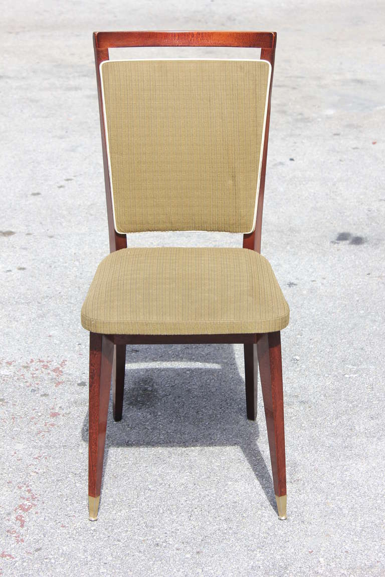 A set of six French Art Deco solid mahogany dining chairs. Reupholstery recommended to be change for all six dining chairs.
