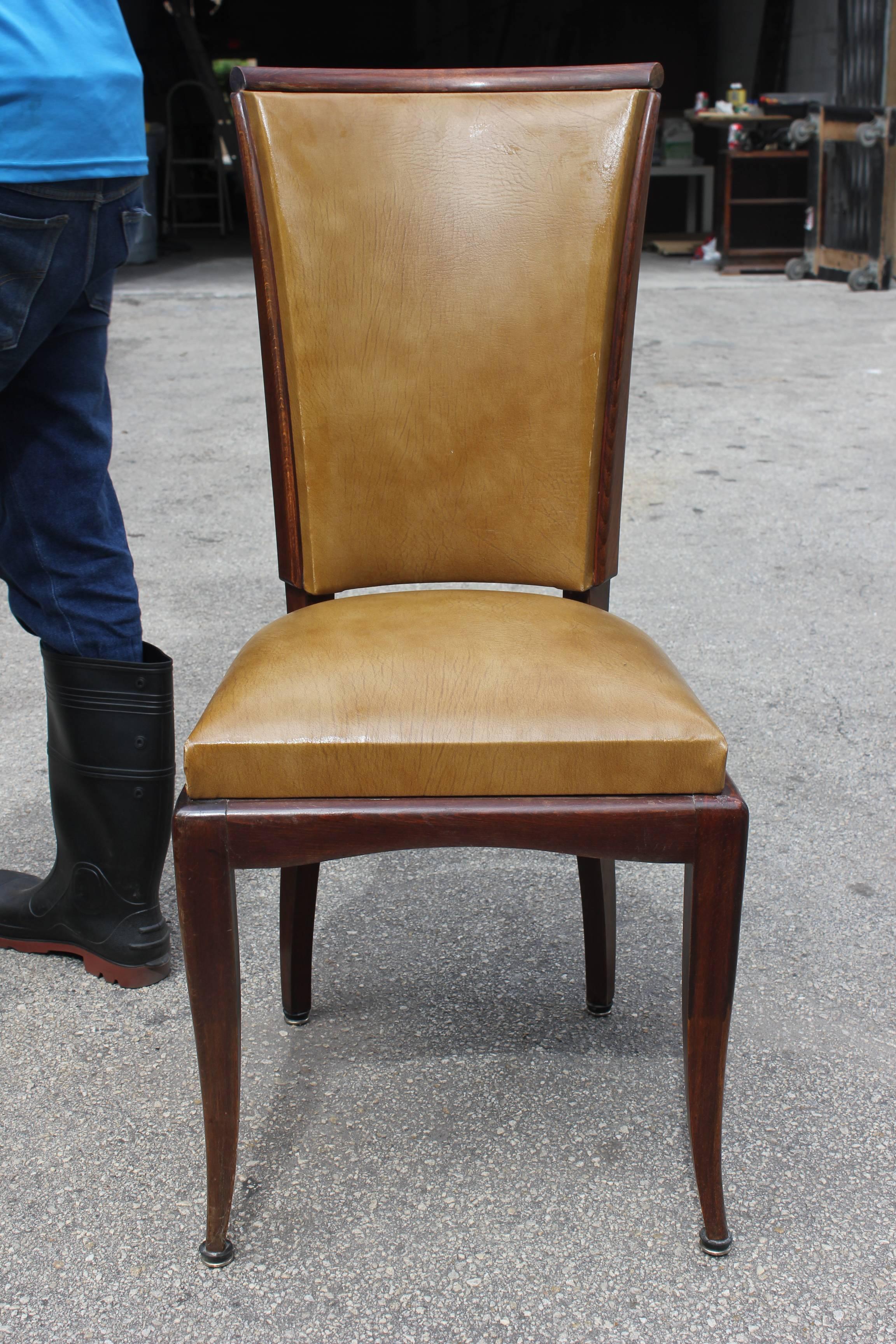 A set of eight French Art Deco walnut dining chairs, circa 1940s. (Reupholstery need to be changed recommended.).