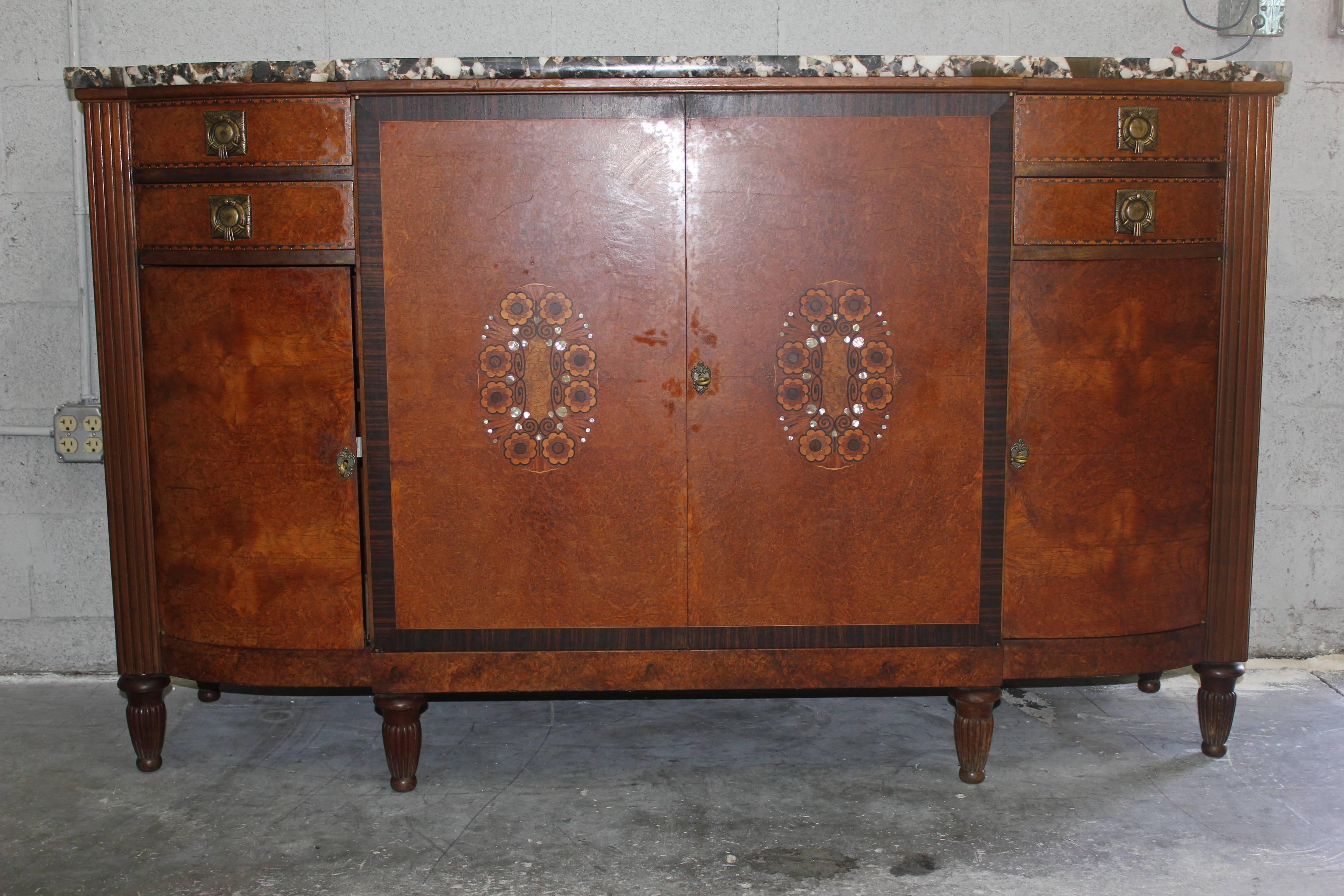 A French Art Deco Sideboard / Buffet burl Amboyna with Macassar ebony and mother-of-pearl detail buffet, circa 1930s. Marble top. Very fine detail.