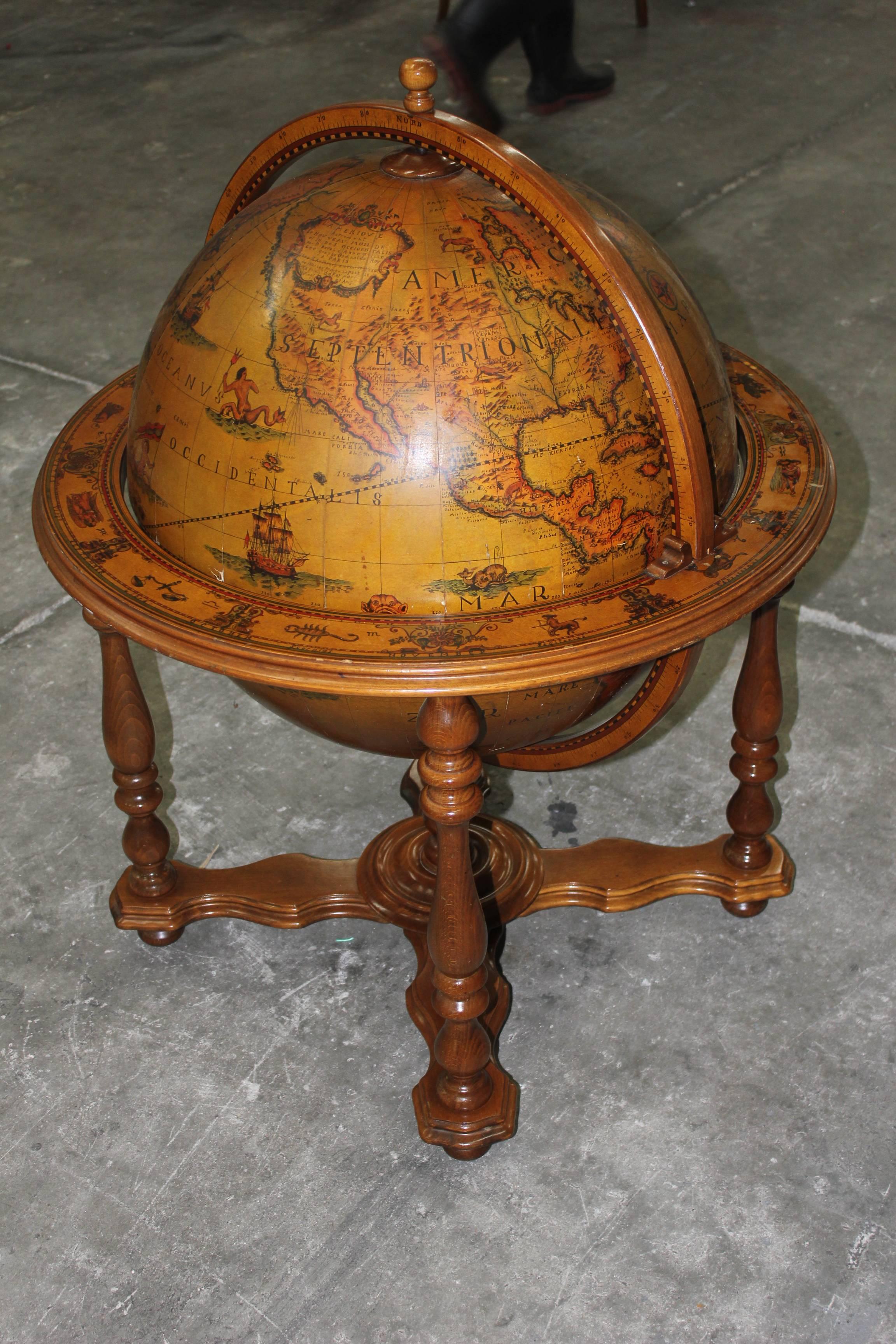 A French Mid-Century Modern World Globe bar, circa 1960s. Globe lifts to reveal bar.