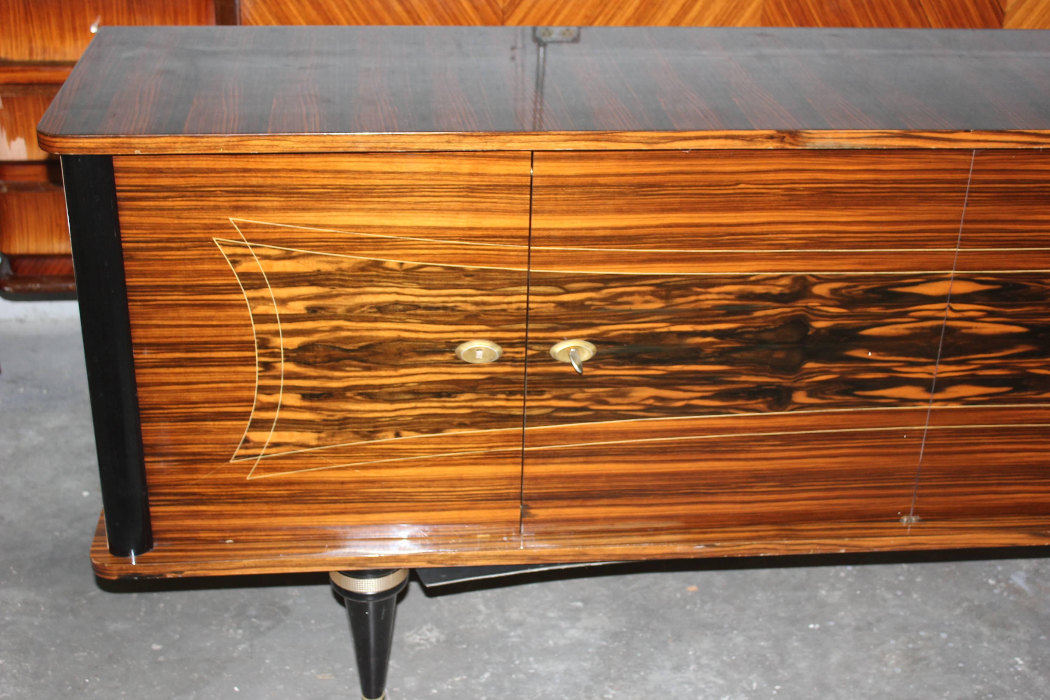 A French Art Deco Sideboard / Buffet Macassar ebony buffet, circa 1940s.high gloss finish and Finished interior.