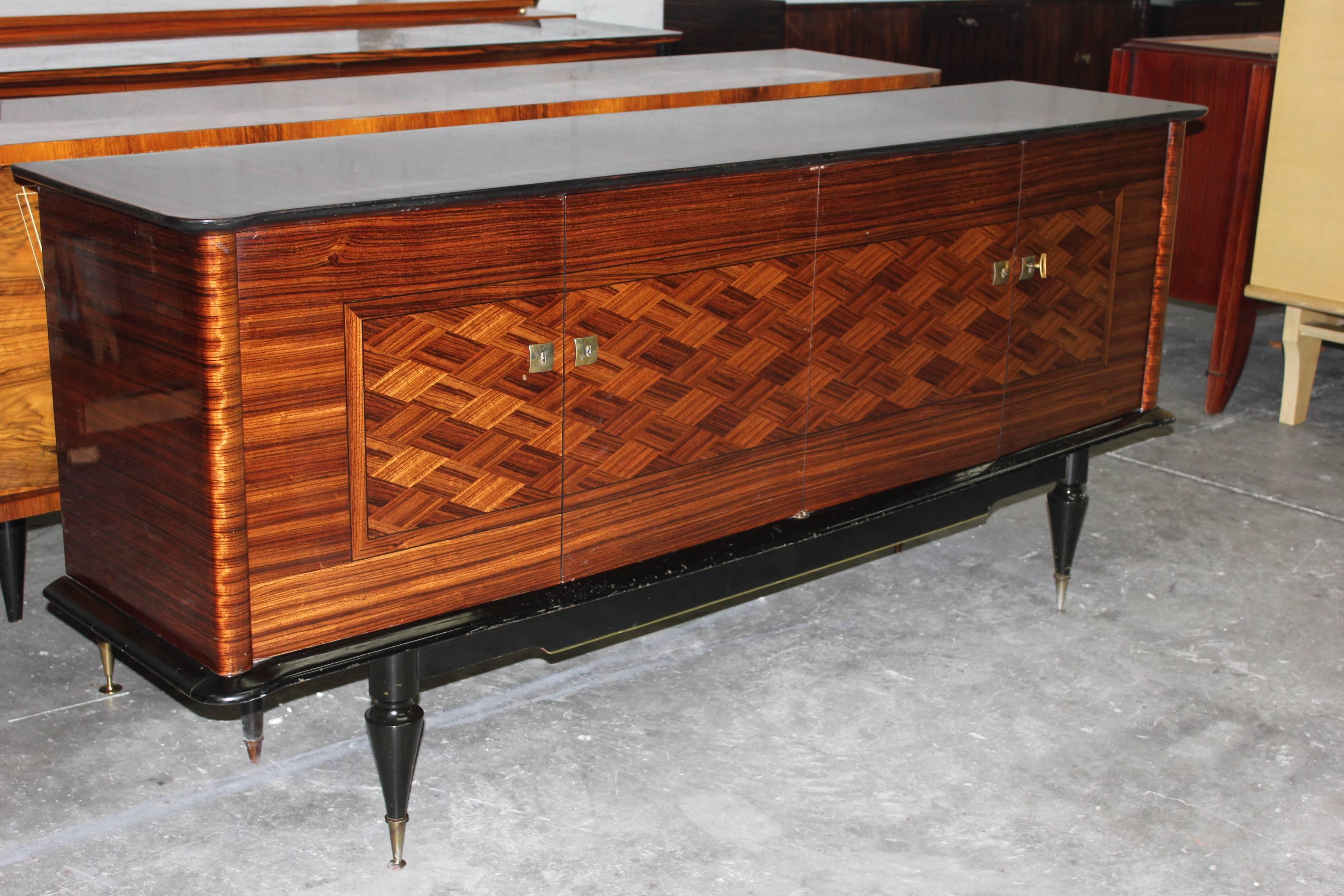 A French Art Deco exotic Macassar ebony buffet, circa 1940s. Finished interior with shelves.